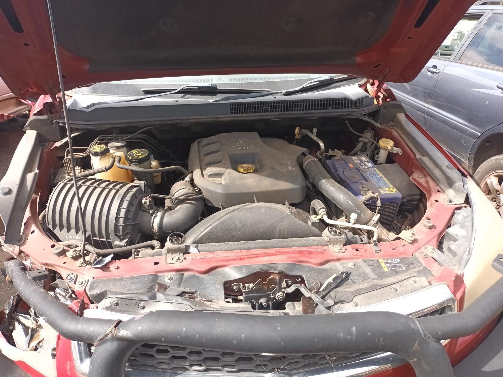 The Engine of a Red Truck is Shown with the Hood Up — South West 4WD Wreckers In Brisbane, QLD