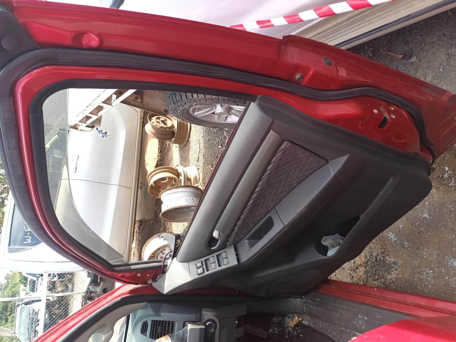 The Inside of a Red Car with the Door Open — South West 4WD Wreckers In Brisbane, QLD