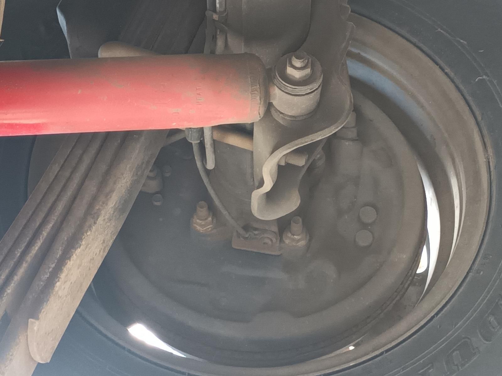 A Close Up of a Car Wheel with a Red Shock Absorber Attached to It — South West 4WD Wreckers In Brisbane, QLD