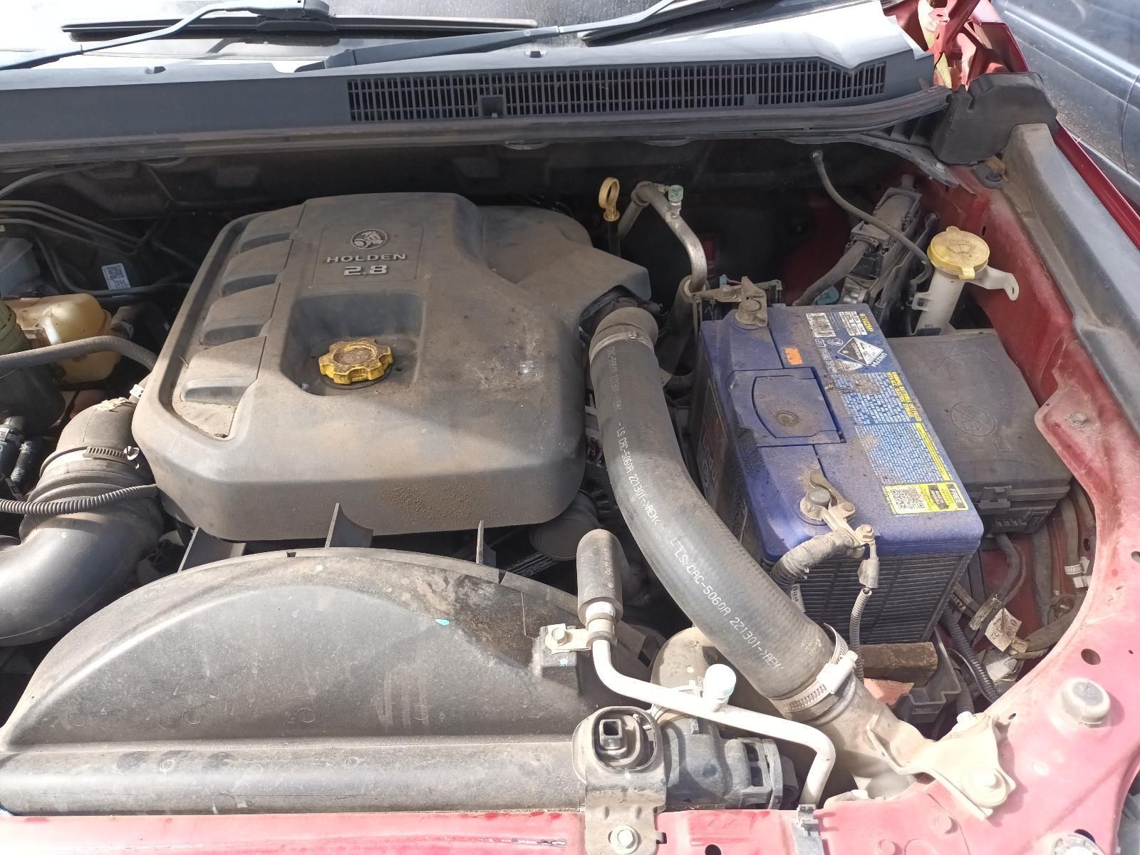 The Engine of a Red Car is Shown with the Hood Open — South West 4WD Wreckers In Brisbane, QLD