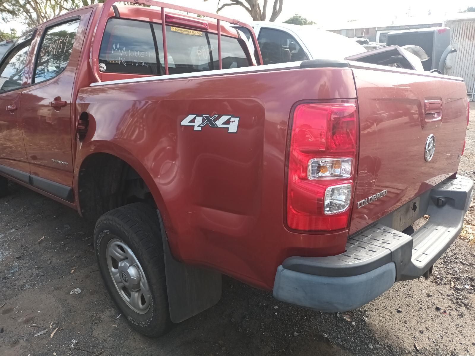 A Red Pickup Truck is Parked in a Parking Lot — South West 4WD Wreckers In Brisbane, QLD