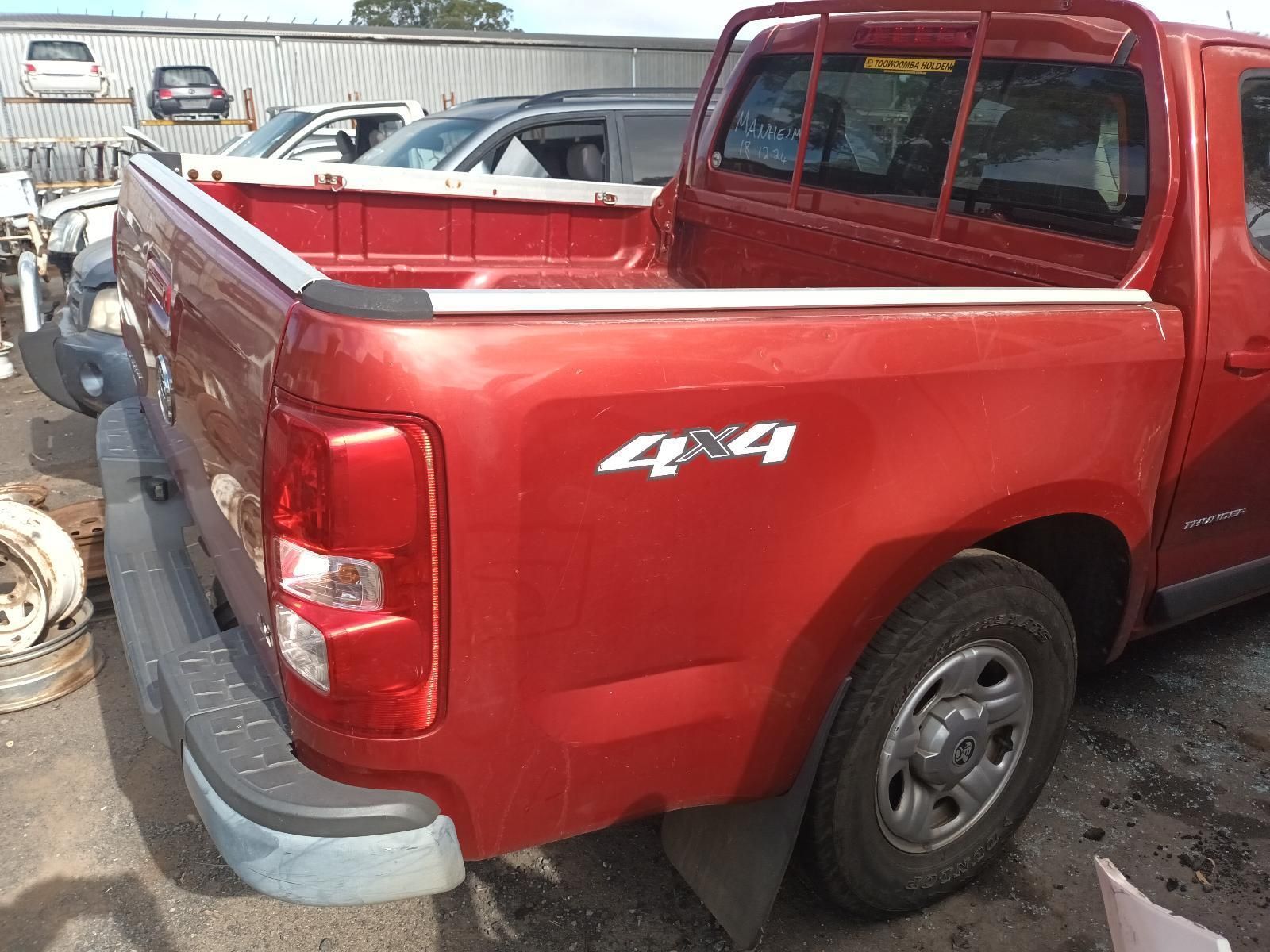 A Red Pickup Truck is Parked in a Parking Lot — South West 4WD Wreckers In Brisbane, QLD