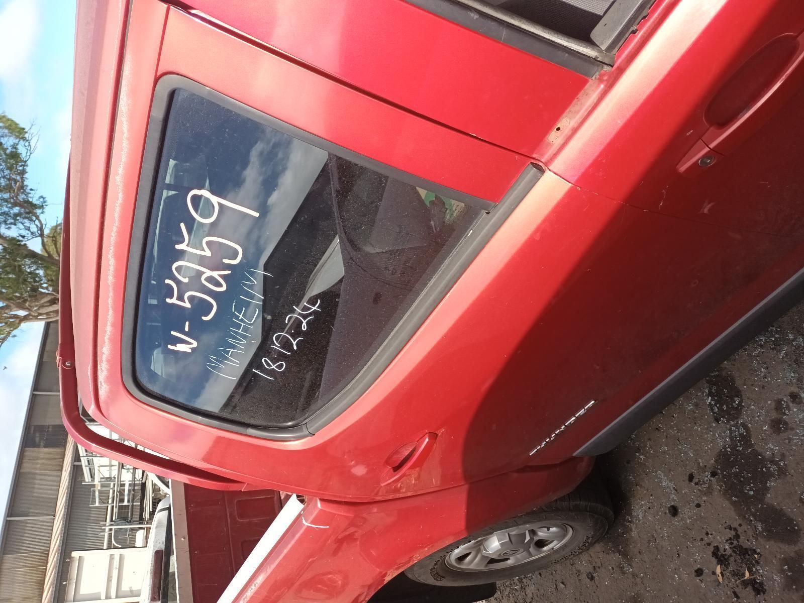 A Red Car with a Numbers Written on Window — South West 4WD Wreckers In Brisbane, QLD
