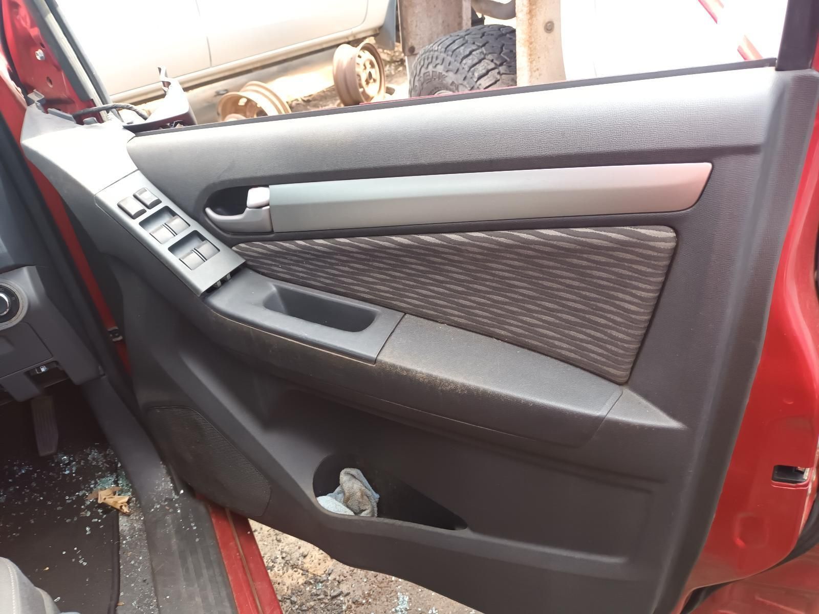 A Red Car with a Tag on the Door That Says JBC — South West 4WD Wreckers In Brisbane, QLD