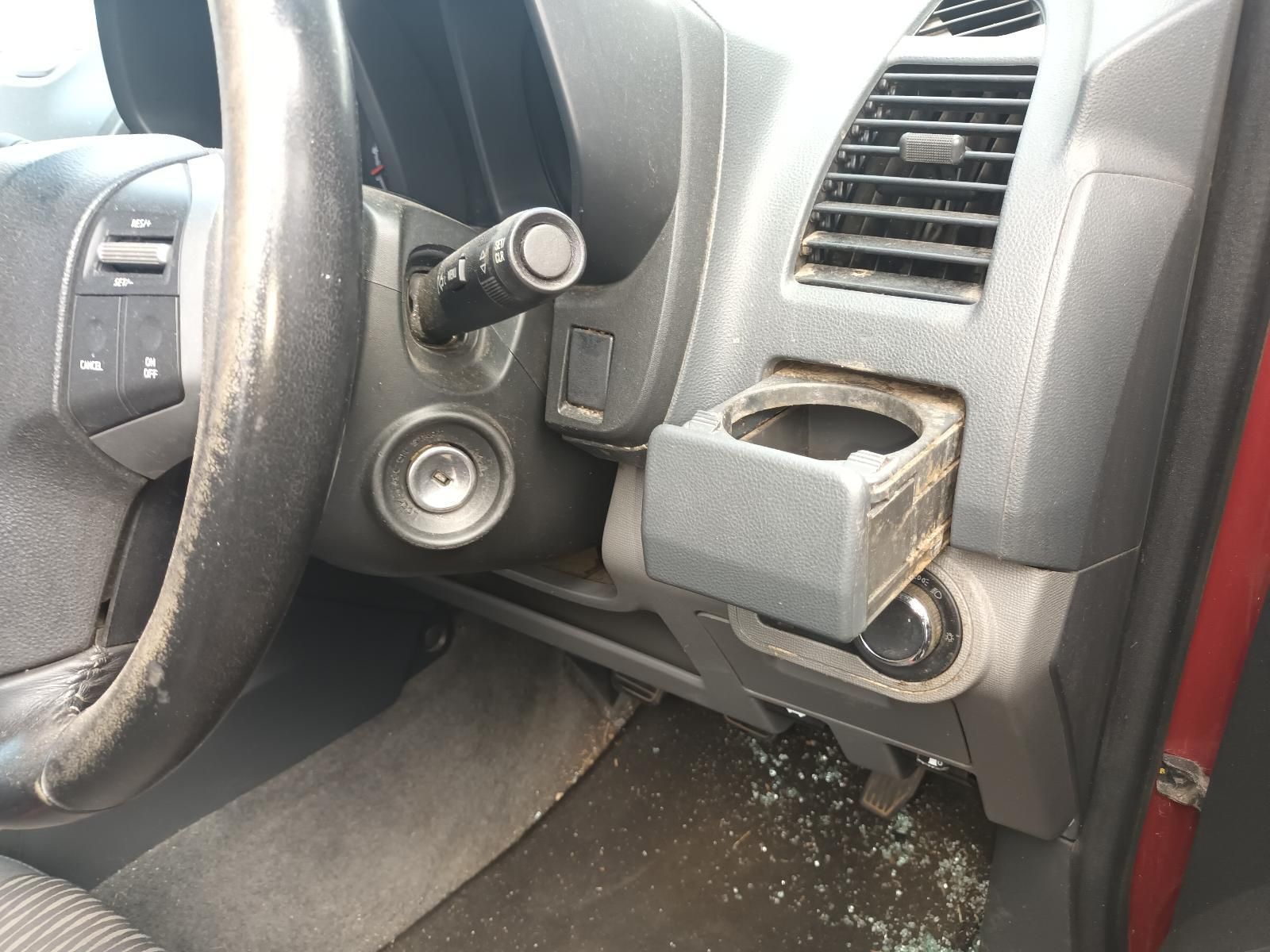 A Car Dashboard with a Cup Holder and a Steering Wheel — South West 4WD Wreckers In Brisbane, QLD