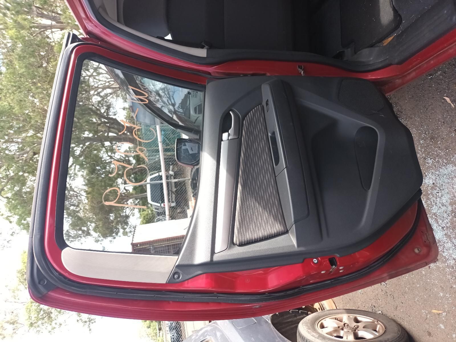 The Back Door of a Red Car is Open — South West 4WD Wreckers In Brisbane, QLD