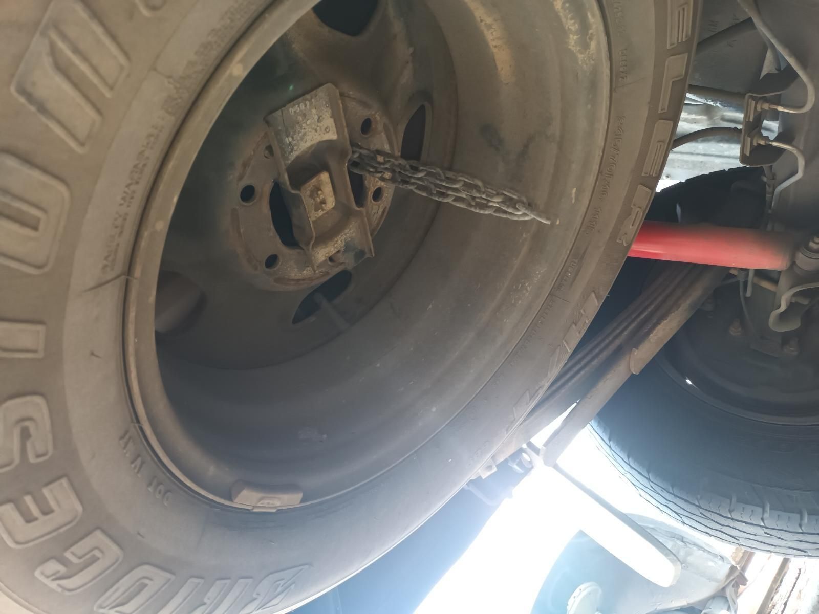 A Close Up of a Tire with a Chain Attached to It — South West 4WD Wreckers In Brisbane, QLD