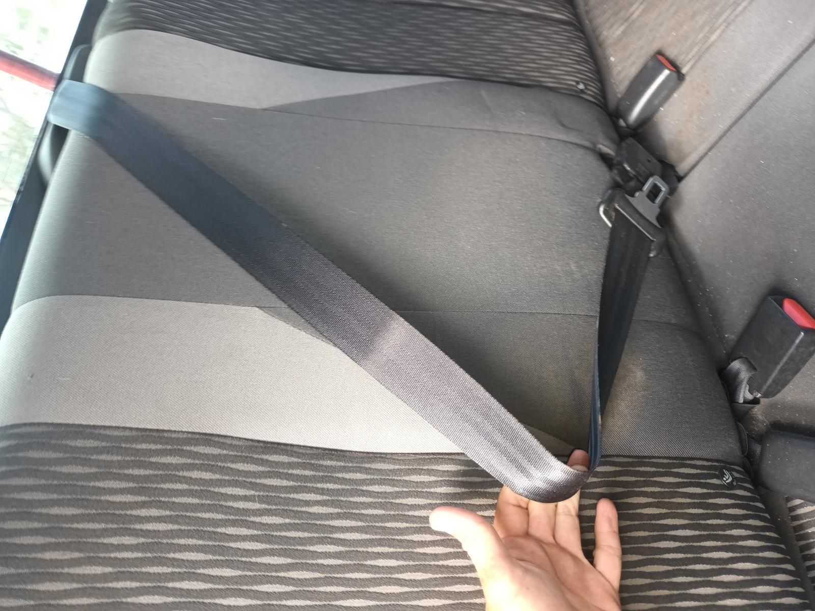 A Person is Holding a Seat Belt in a Car — South West 4WD Wreckers In Brisbane, QLD