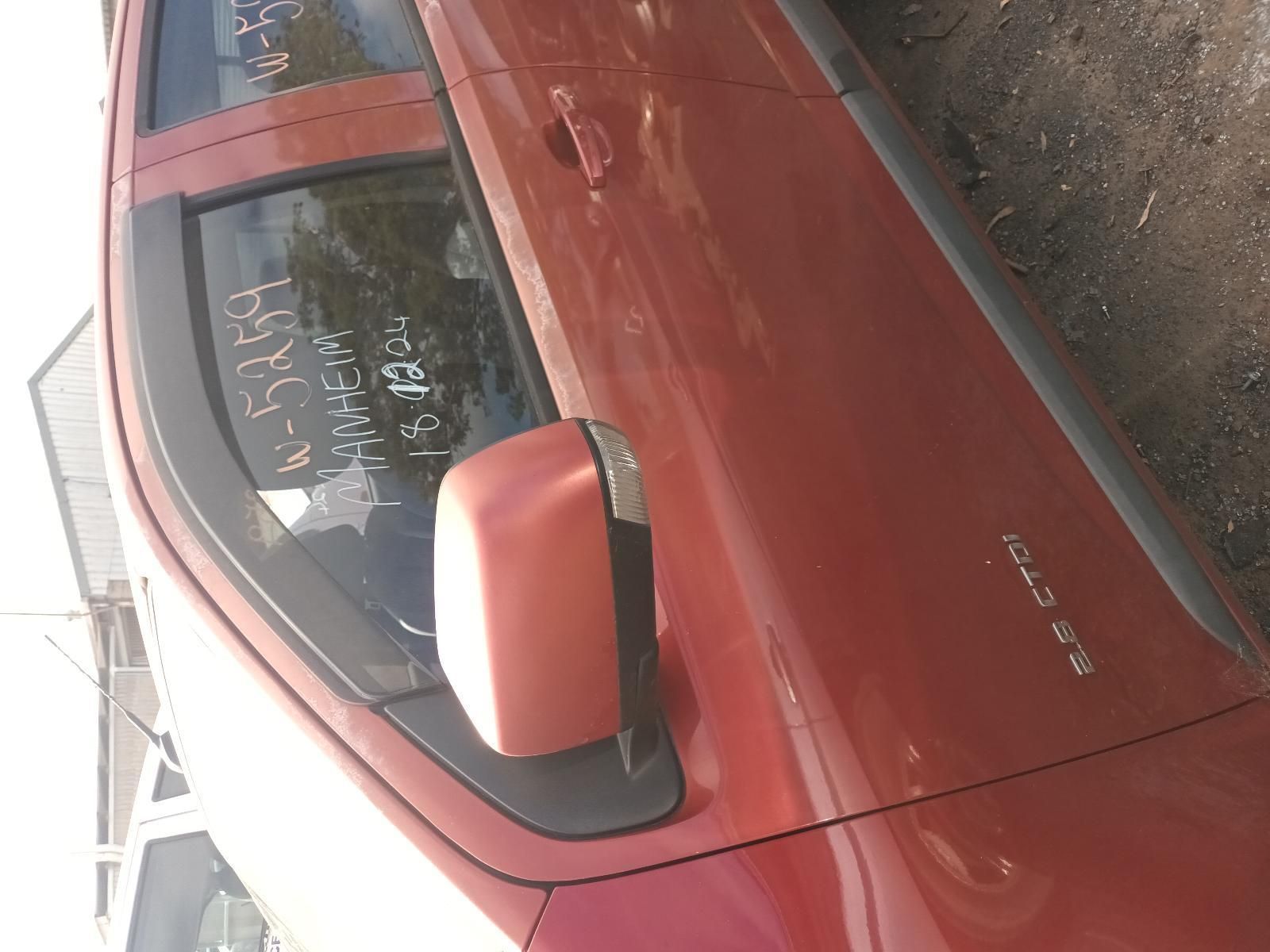 A Red Car is Parked on the Side of the Road — South West 4WD Wreckers In Brisbane, QLD
