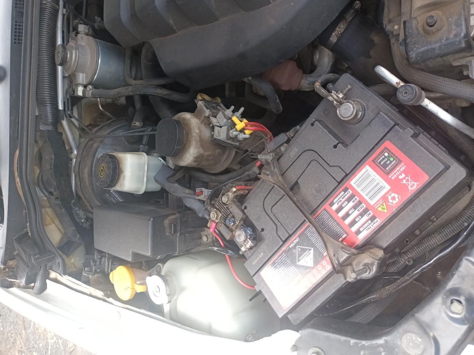 A Car with the Hood Open and a Battery in the Engine Compartment — South West 4WD Wreckers In Brisbane, QLD