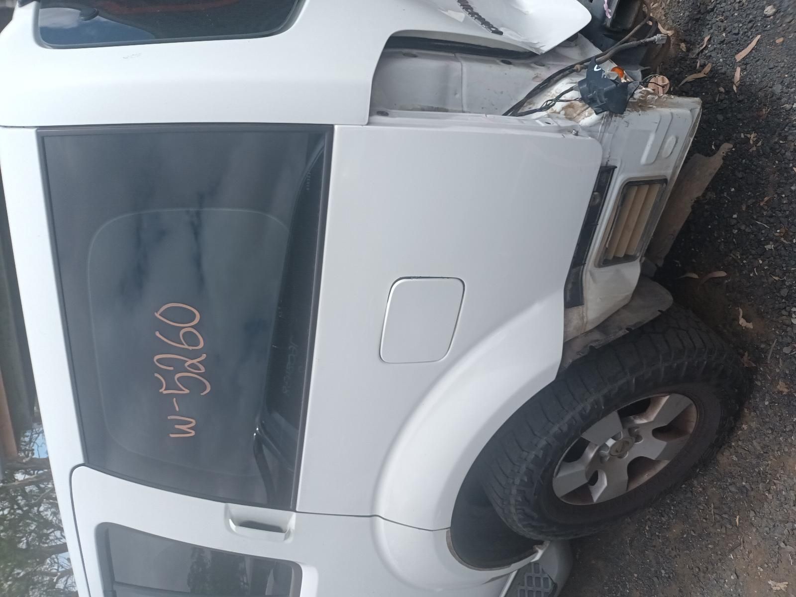 A White Car with the Numbers Written on the Side of It — South West 4WD Wreckers In Brisbane, QLD