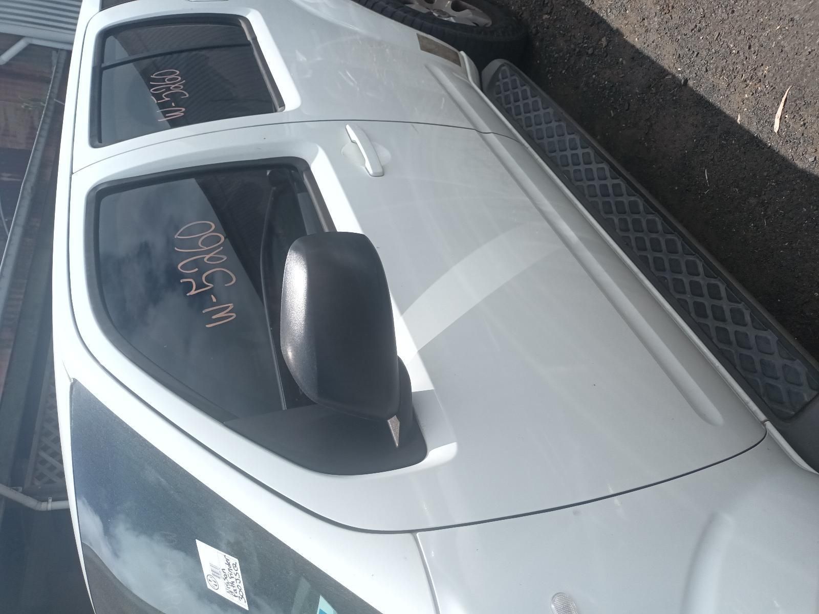 A White Truck is Parked on the Side of the Road — South West 4WD Wreckers In Brisbane, QLD