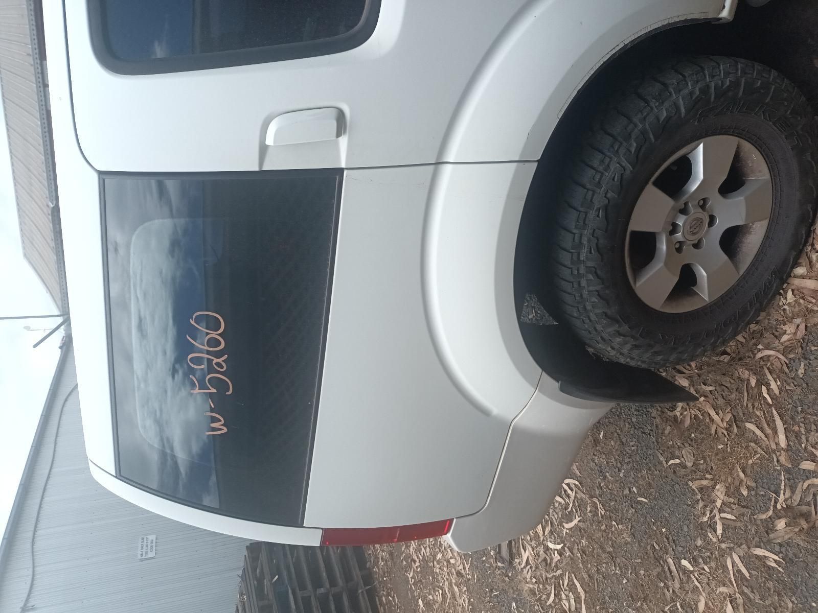 A White Car is Parked on the Ground — South West 4WD Wreckers In Brisbane, QLD
