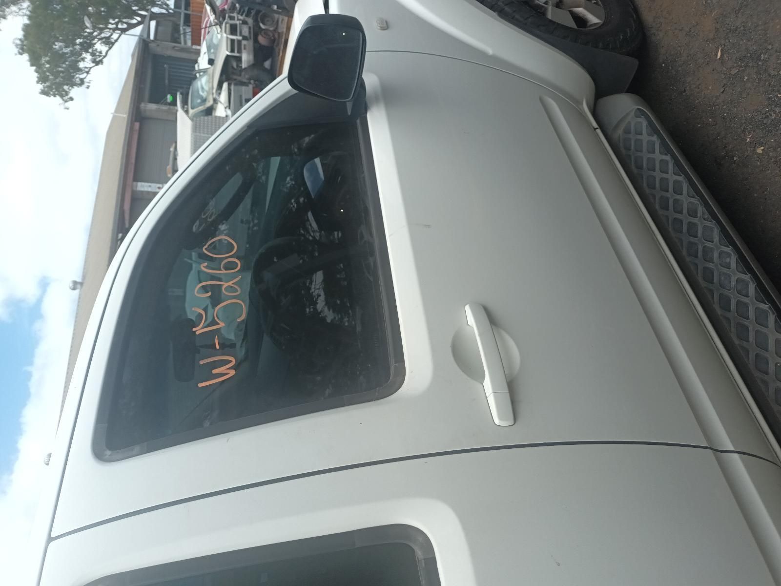 A White Truck is Parked on the Side of the Road — South West 4WD Wreckers In Brisbane, QLD