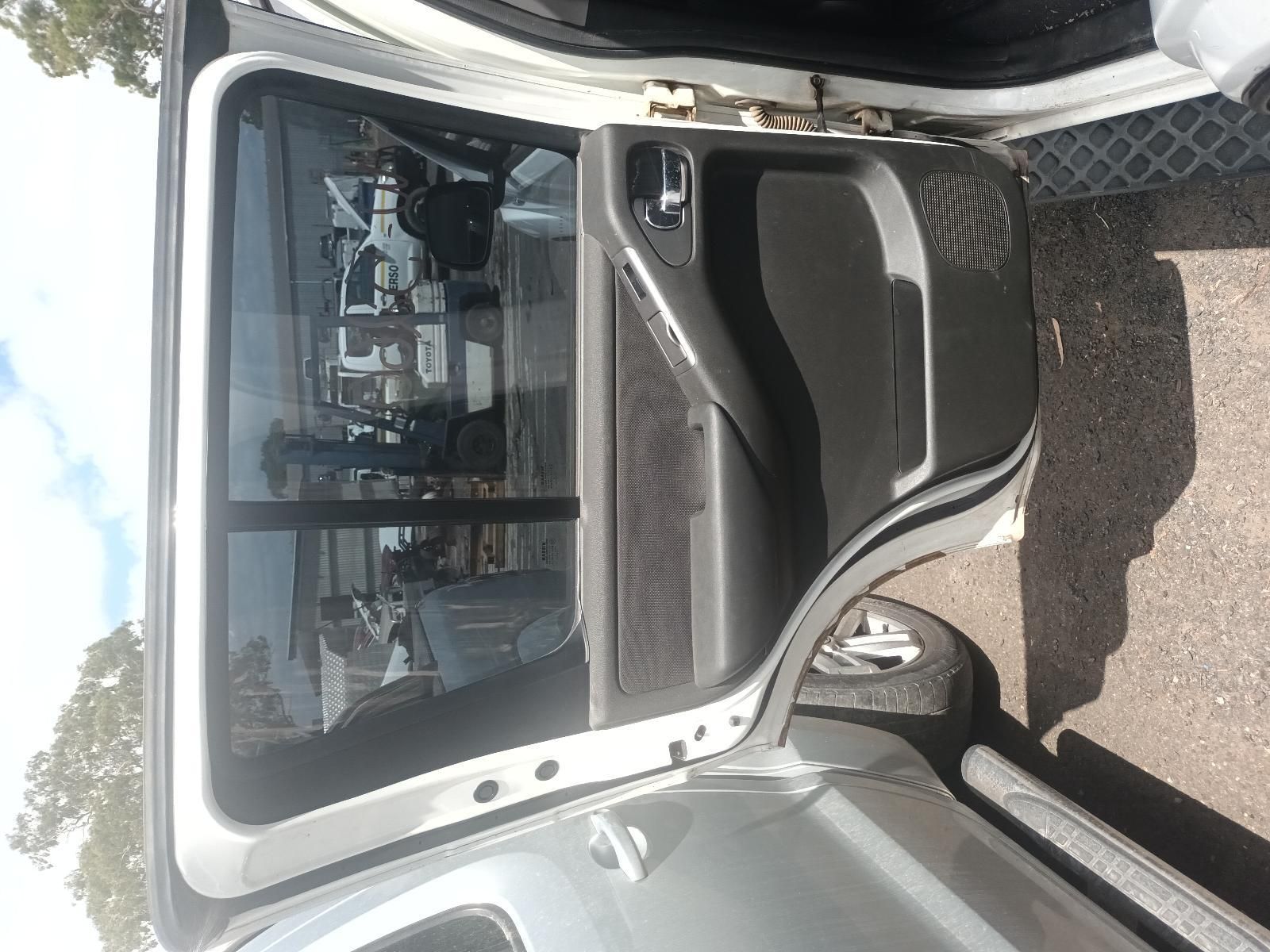 The Back Door of a Silver Car is Open — South West 4WD Wreckers In Brisbane, QLD