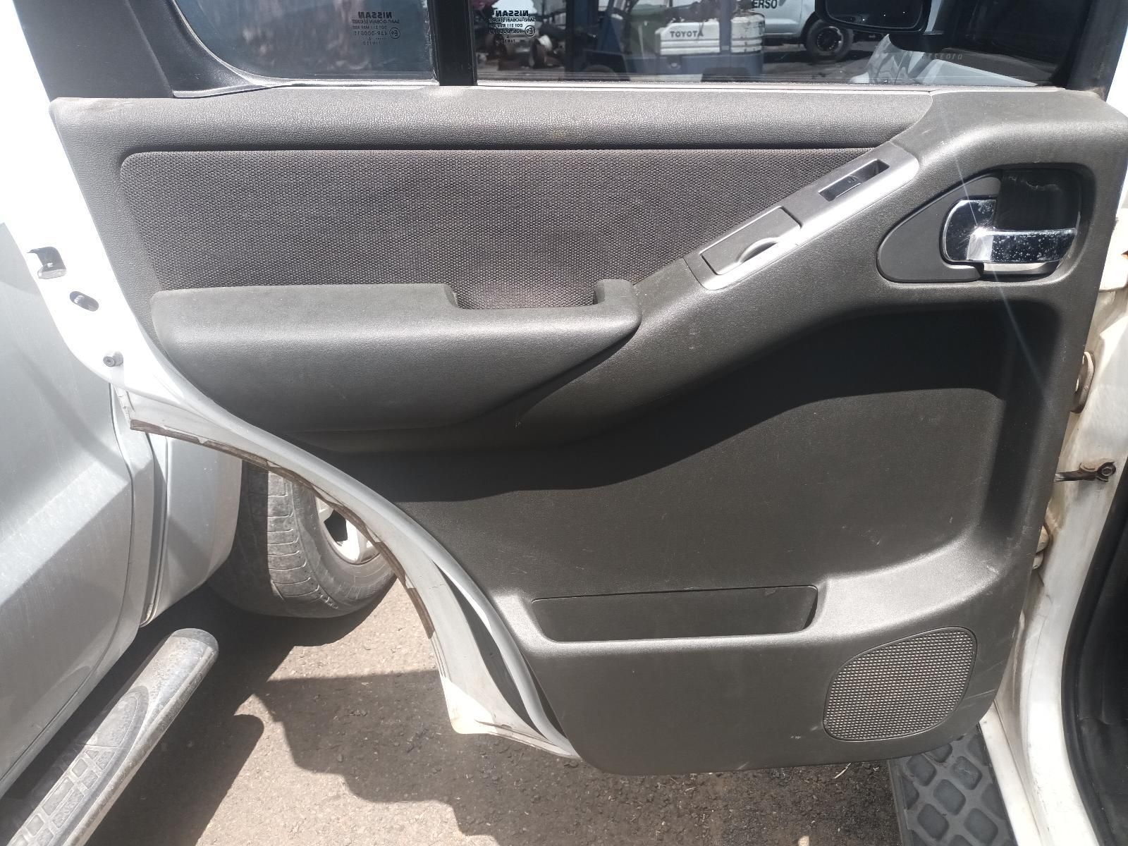 A White Car with the Door Open and a Black Door Panel — South West 4WD Wreckers In Brisbane, QLD