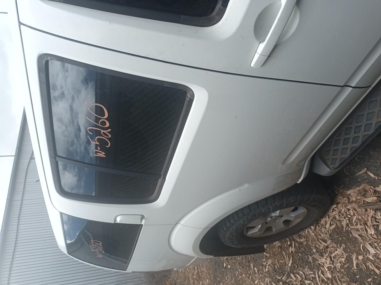 A White Car with the Word Open on the Back Window — South West 4WD Wreckers In Brisbane, QLD 