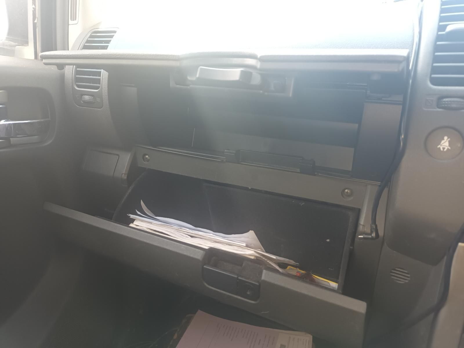 A Glove Box in a Car with Papers in It — South West 4WD Wreckers In Brisbane, QLD