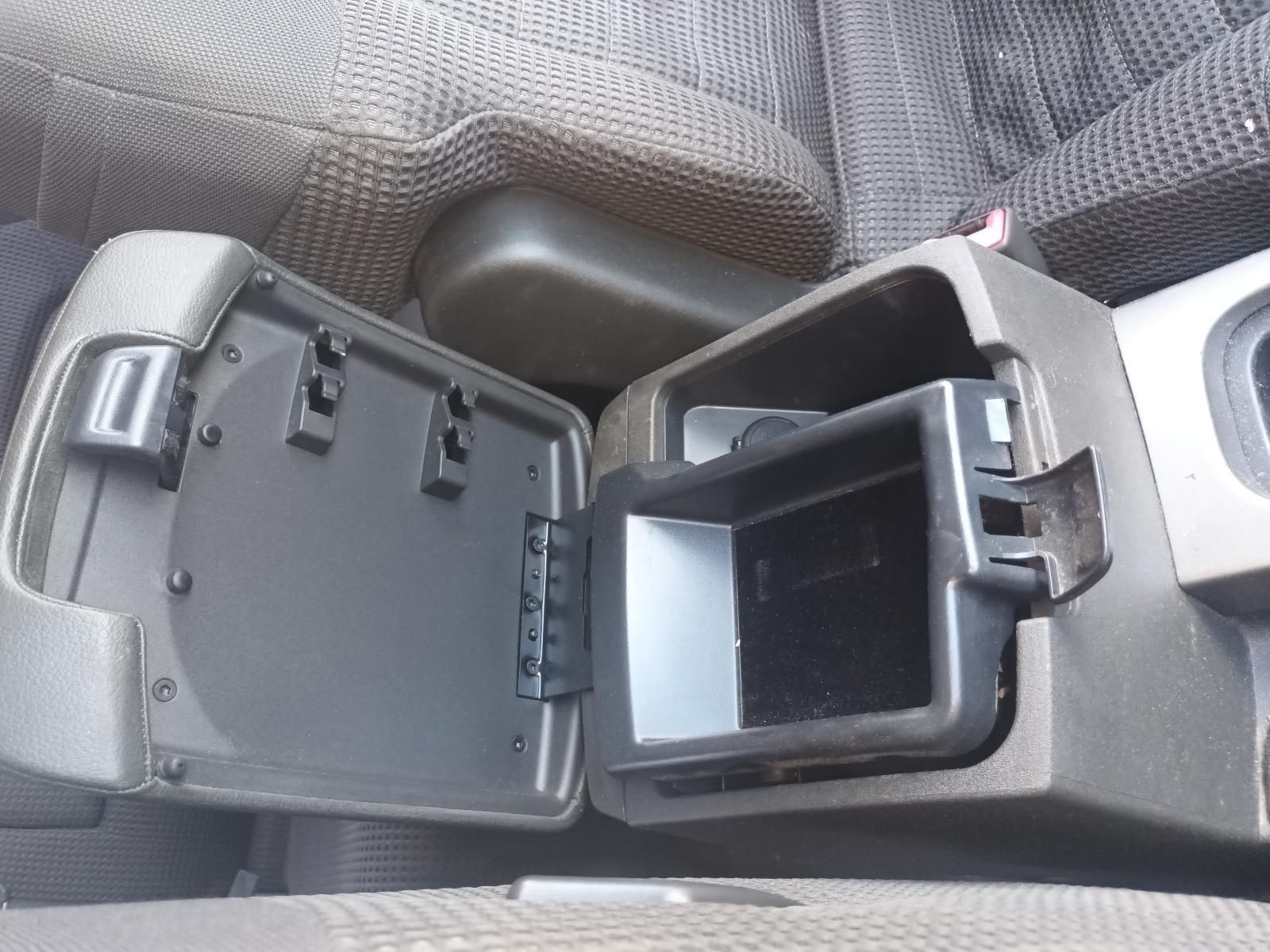 A Car Console with the Lid Open and a Container Inside — South West 4WD Wreckers In Brisbane, QLD