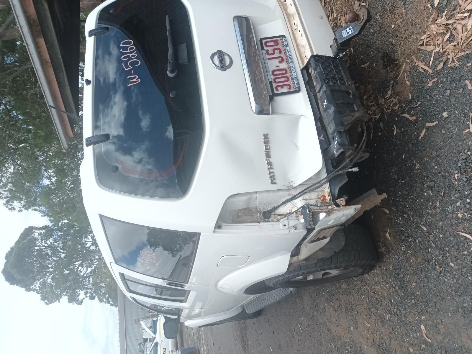 A White Nissan Patrol is Sitting on the Side of the Road — South West 4WD Wreckers In Brisbane, QLD