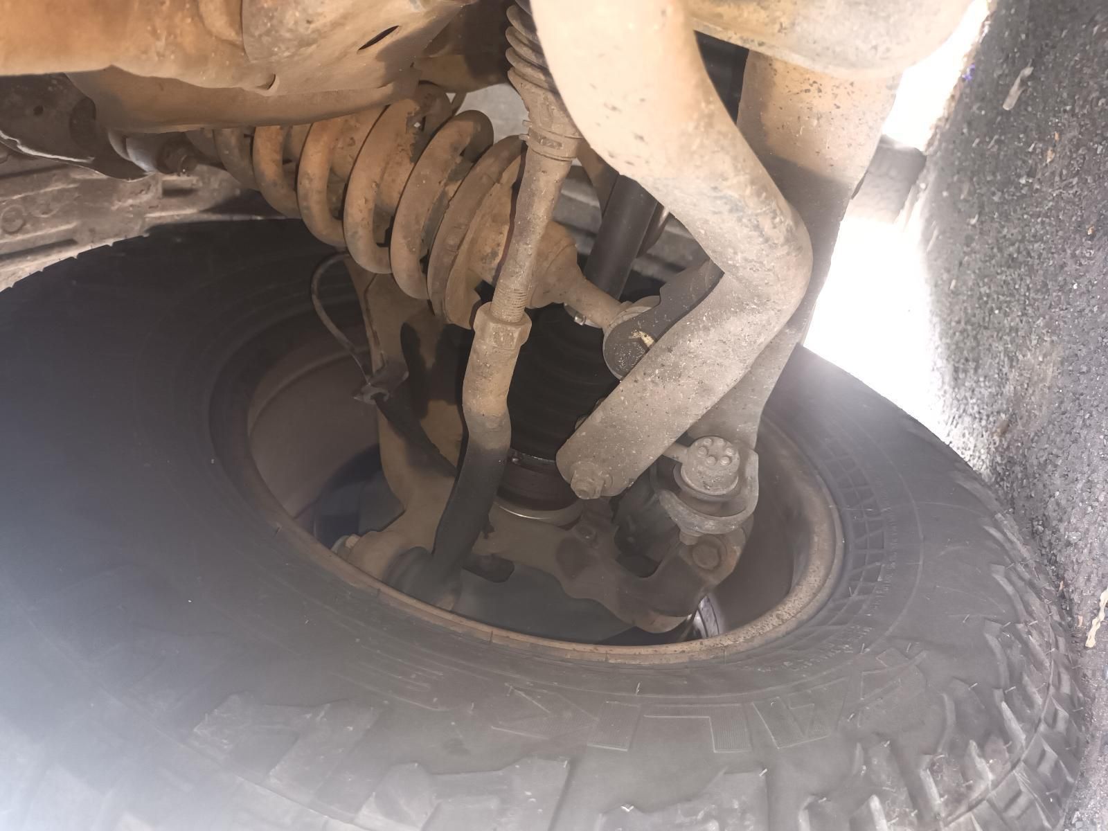A Close Up of the Underside of a Car with a Tire — South West 4WD Wreckers In Brisbane, QLD