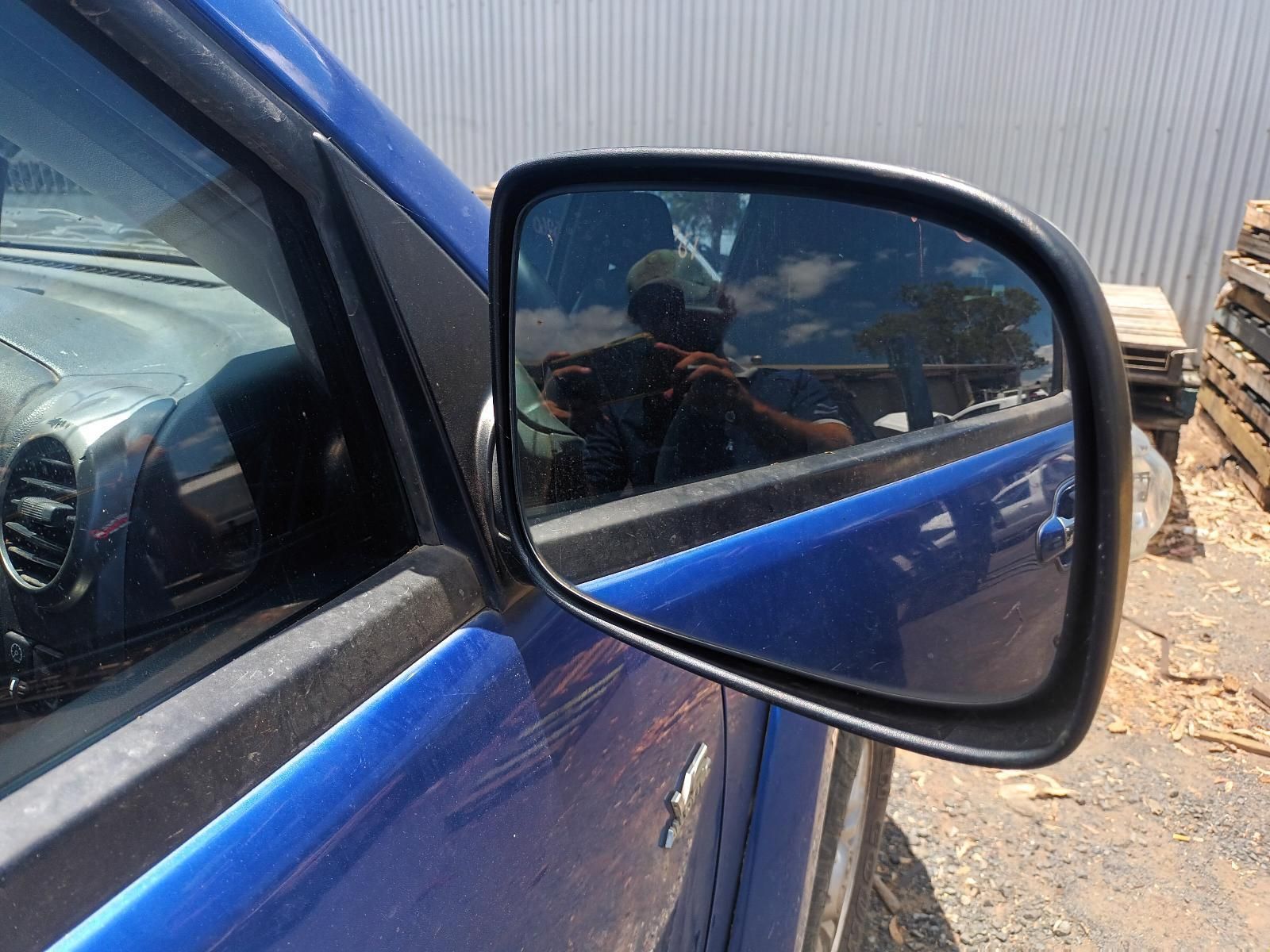 A Close Up of a Blue Car's Side View Mirror — South West 4WD Wreckers In Brisbane, QLD