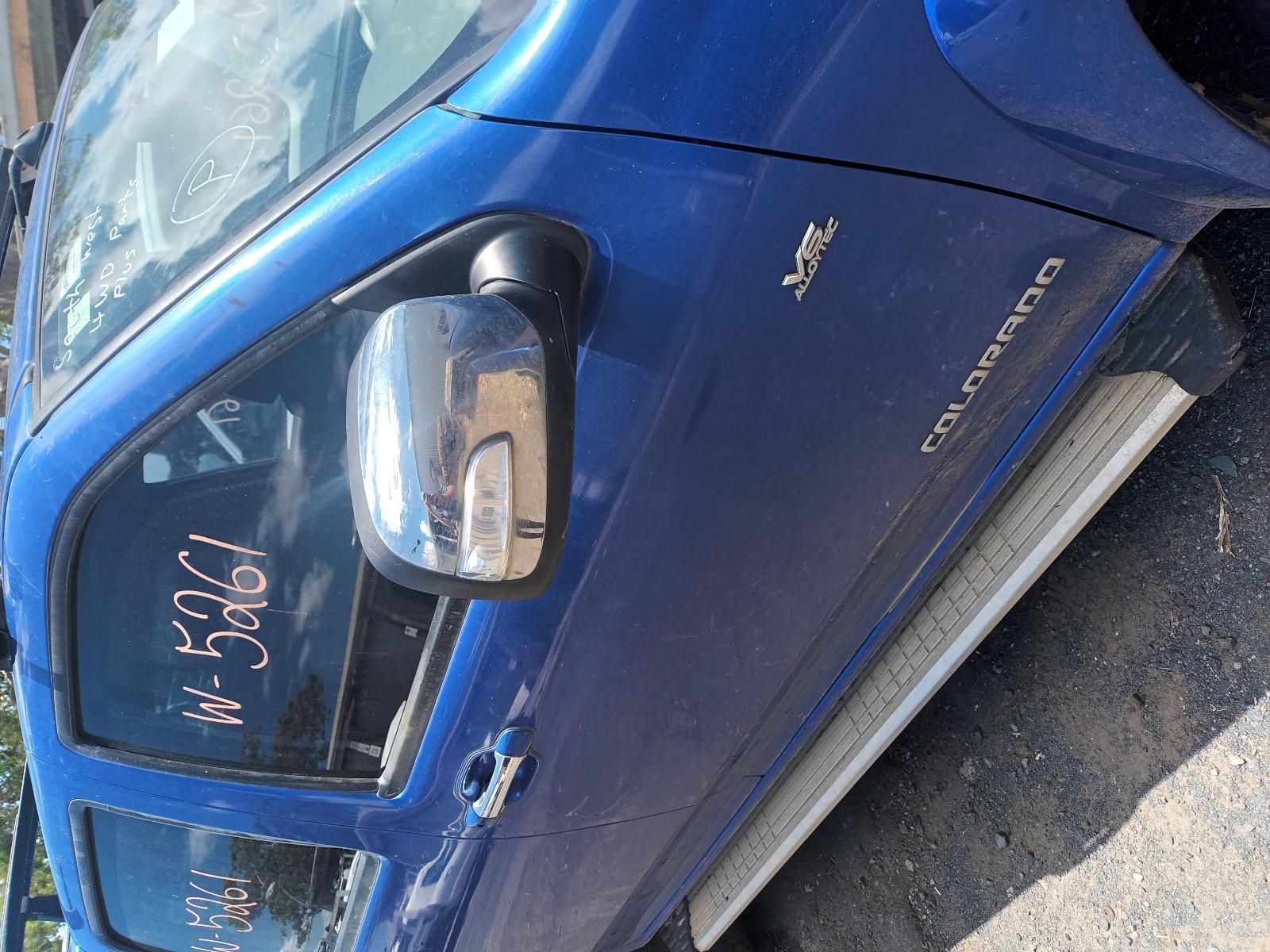 A Blue Colorado Truck is Parked on the Side of the Road — South West 4WD Wreckers In Brisbane, QLD