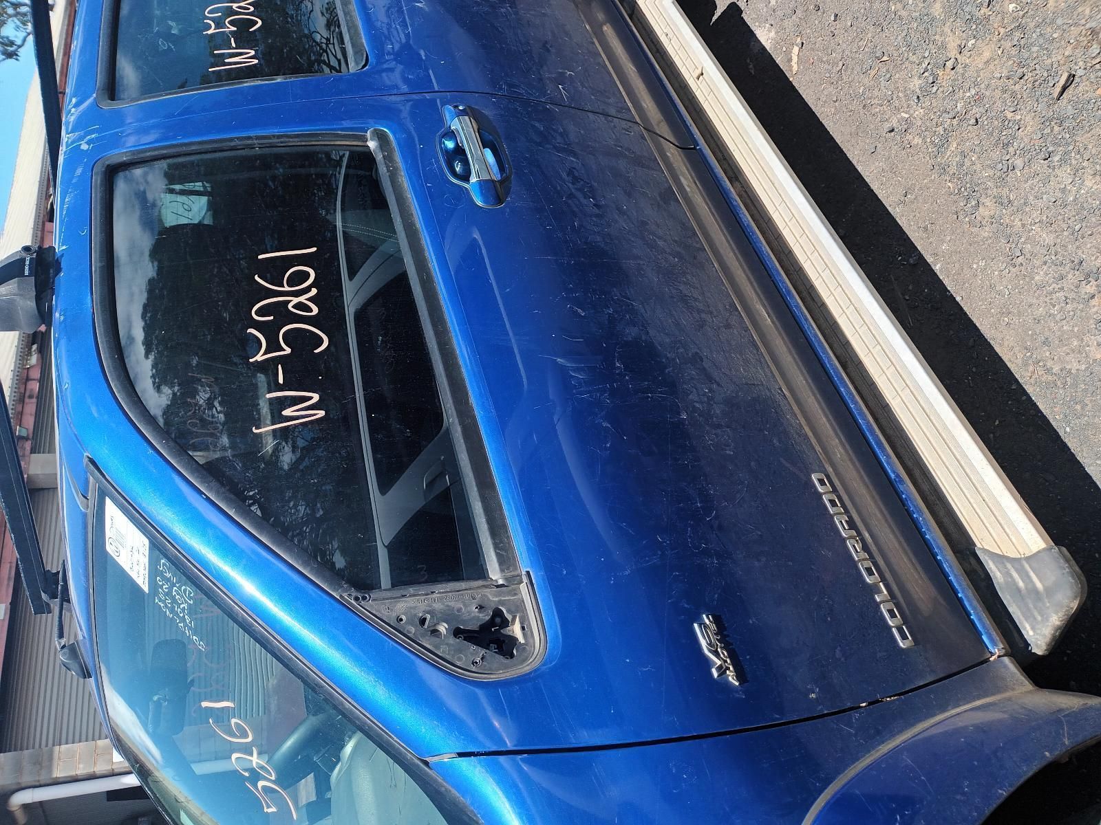 A Blue Truck with a Numbers on Window — South West 4WD Wreckers In Brisbane, QLD