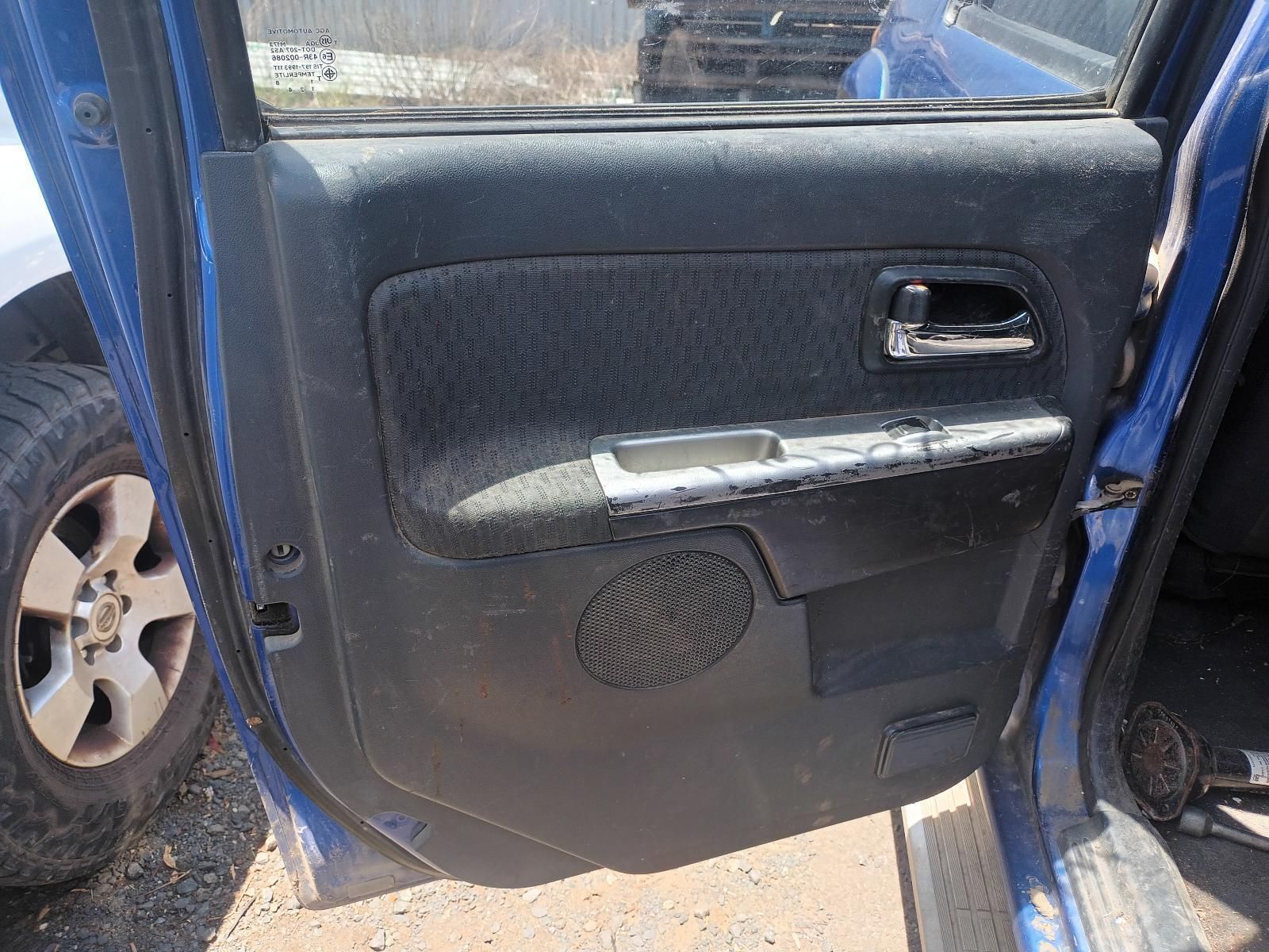 The Door of a Blue Car is Open and Sitting on the Ground — South West 4WD Wreckers In Brisbane, QLD