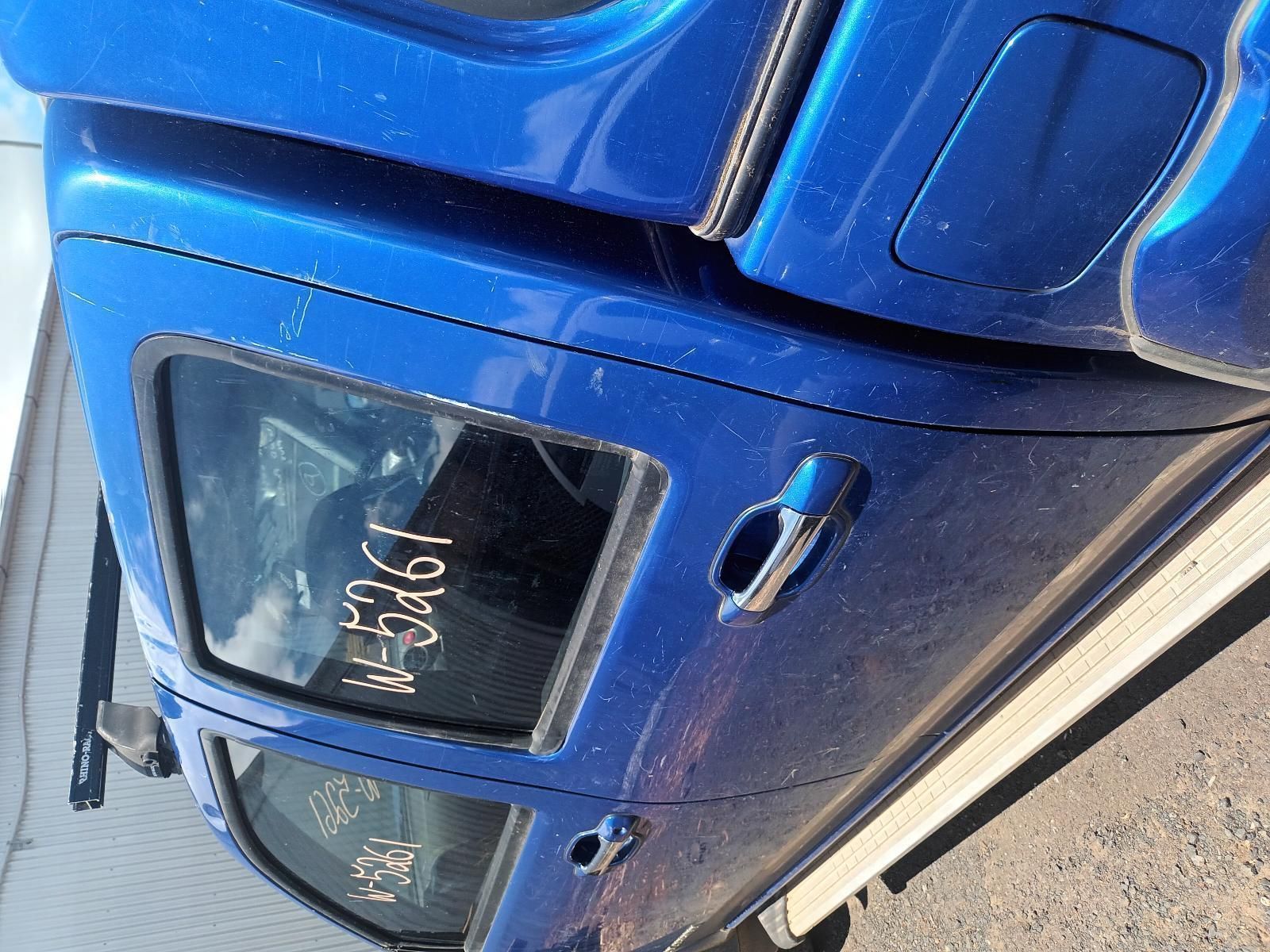 A Blue Truck with a Numbers on the Door — South West 4WD Wreckers In Brisbane, QLD