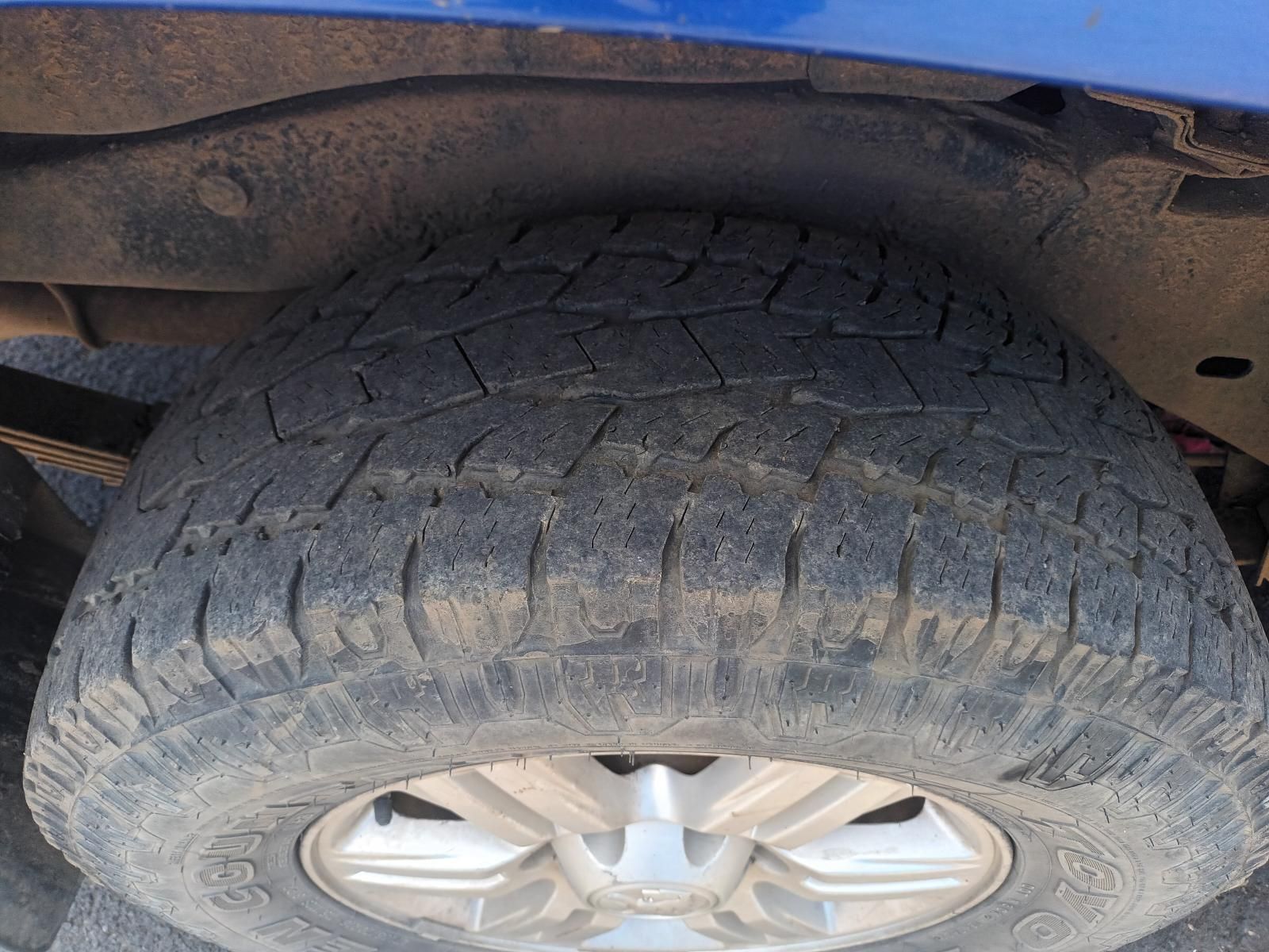 A Close Up of a Tire on a Blue Truck — South West 4WD Wreckers In Brisbane, QLD