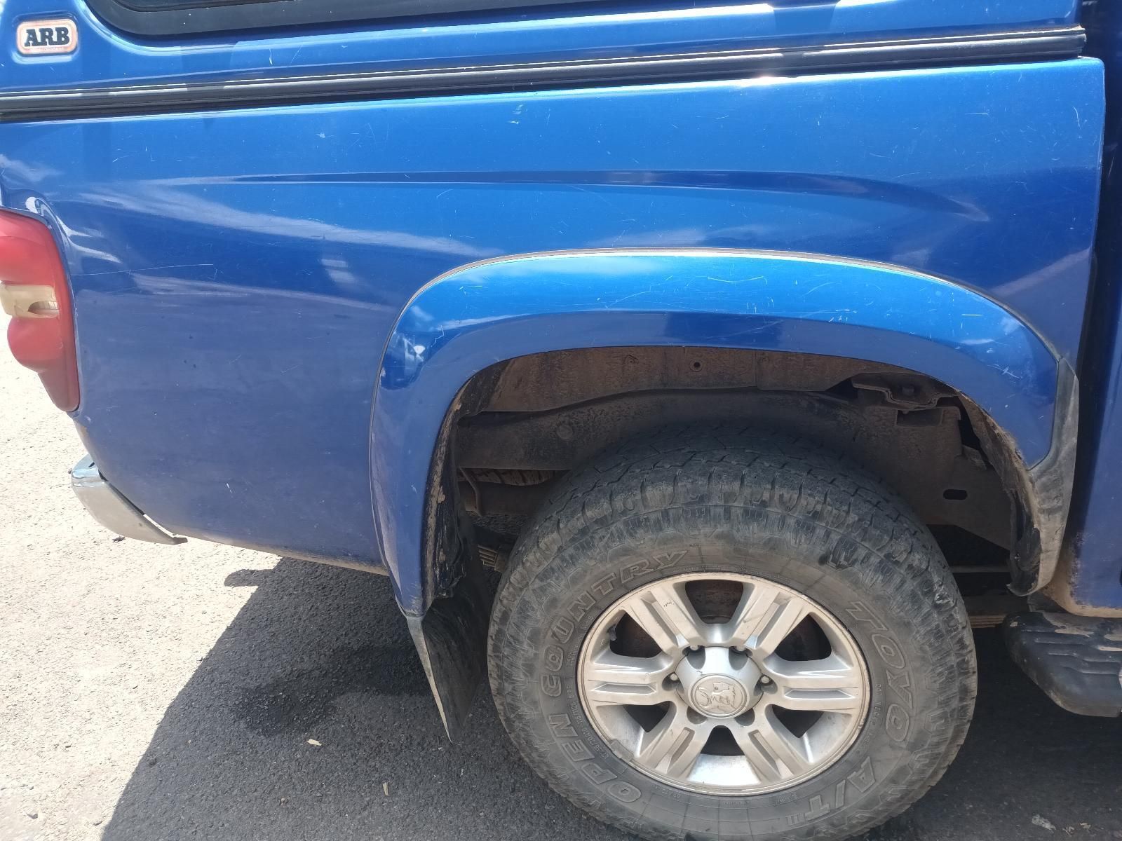A Blue Truck is Parked on the Side of the Road — South West 4WD Wreckers In Brisbane, QLD