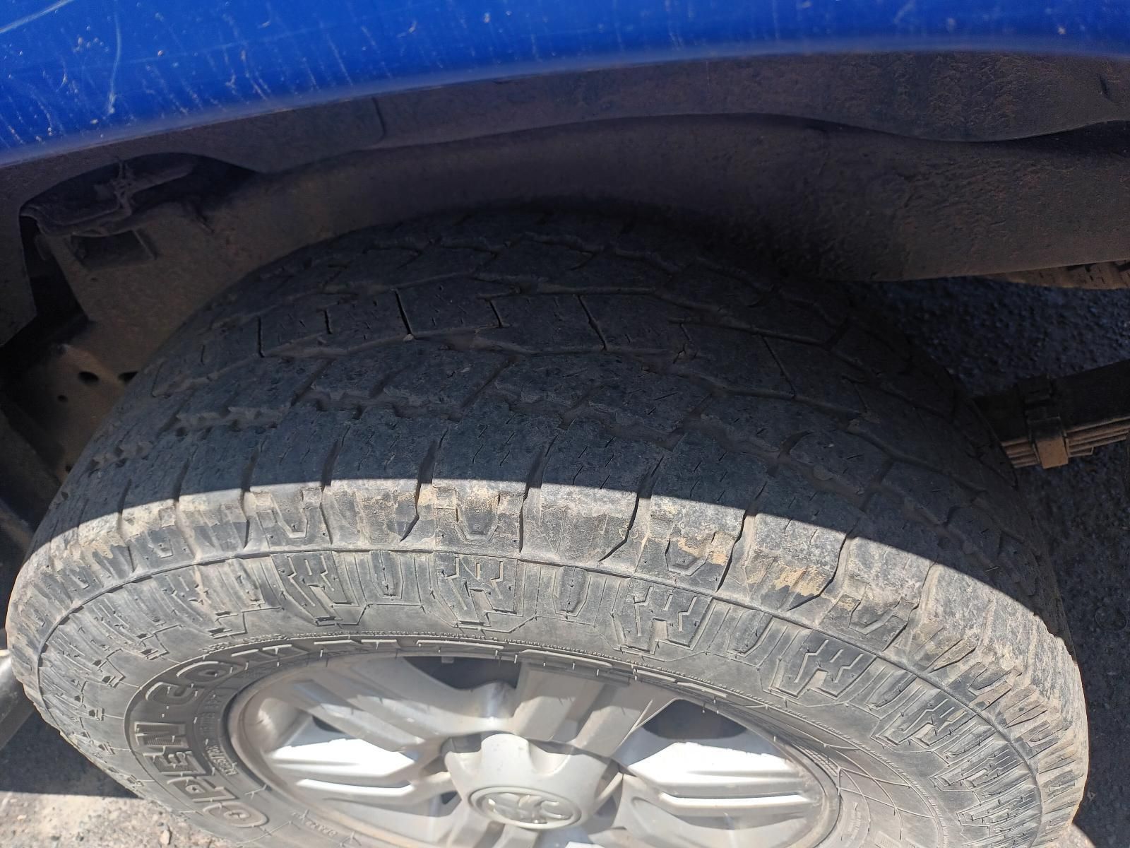 A Close Up of a Tire on a Blue Truck — South West 4WD Wreckers In Brisbane, QLD