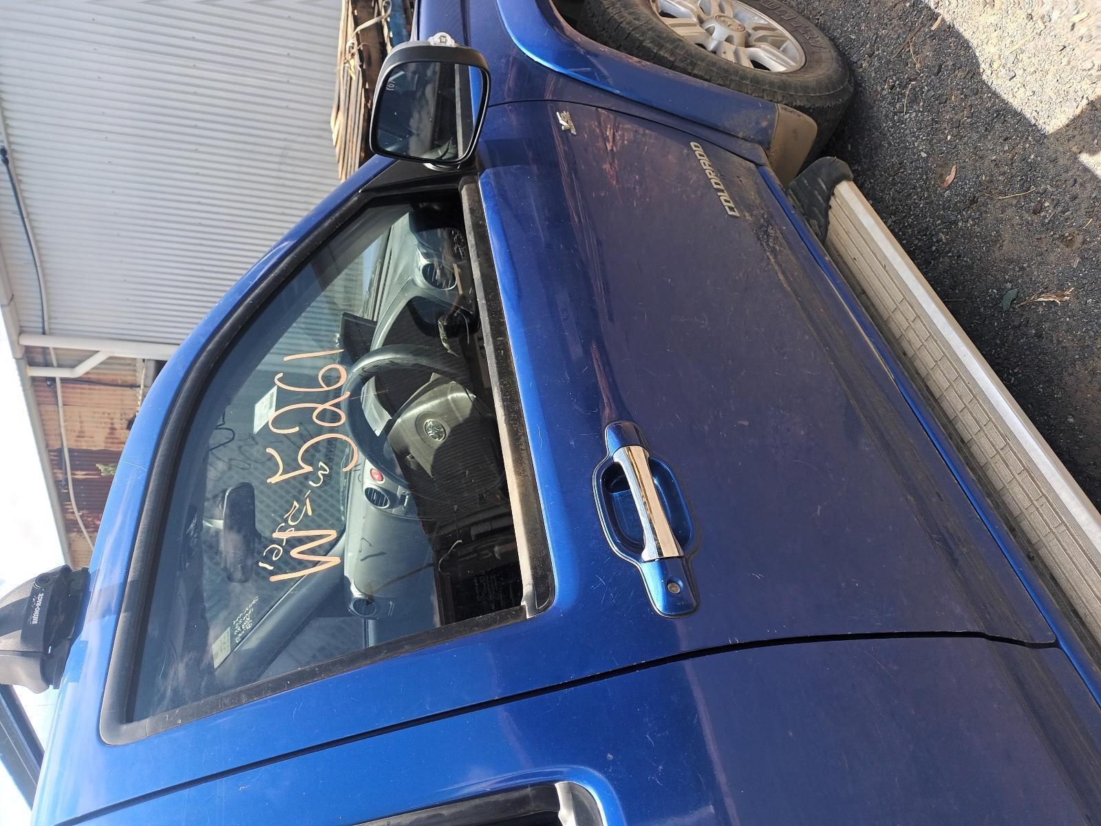 A Blue Truck is Parked on the Side of the Road — South West 4WD Wreckers In Brisbane, QLD