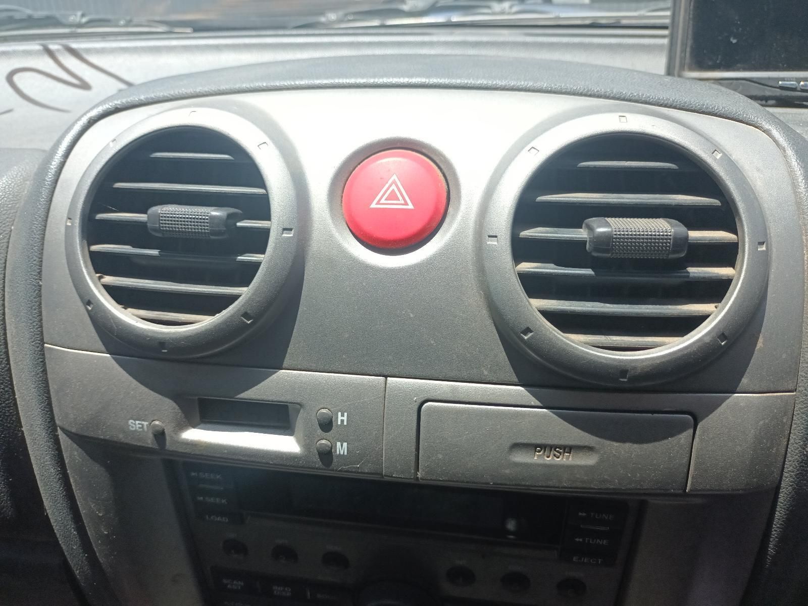 The Dashboard of a Car Has a Red Button with a Triangle on It — South West 4WD Wreckers In Brisbane, QLD