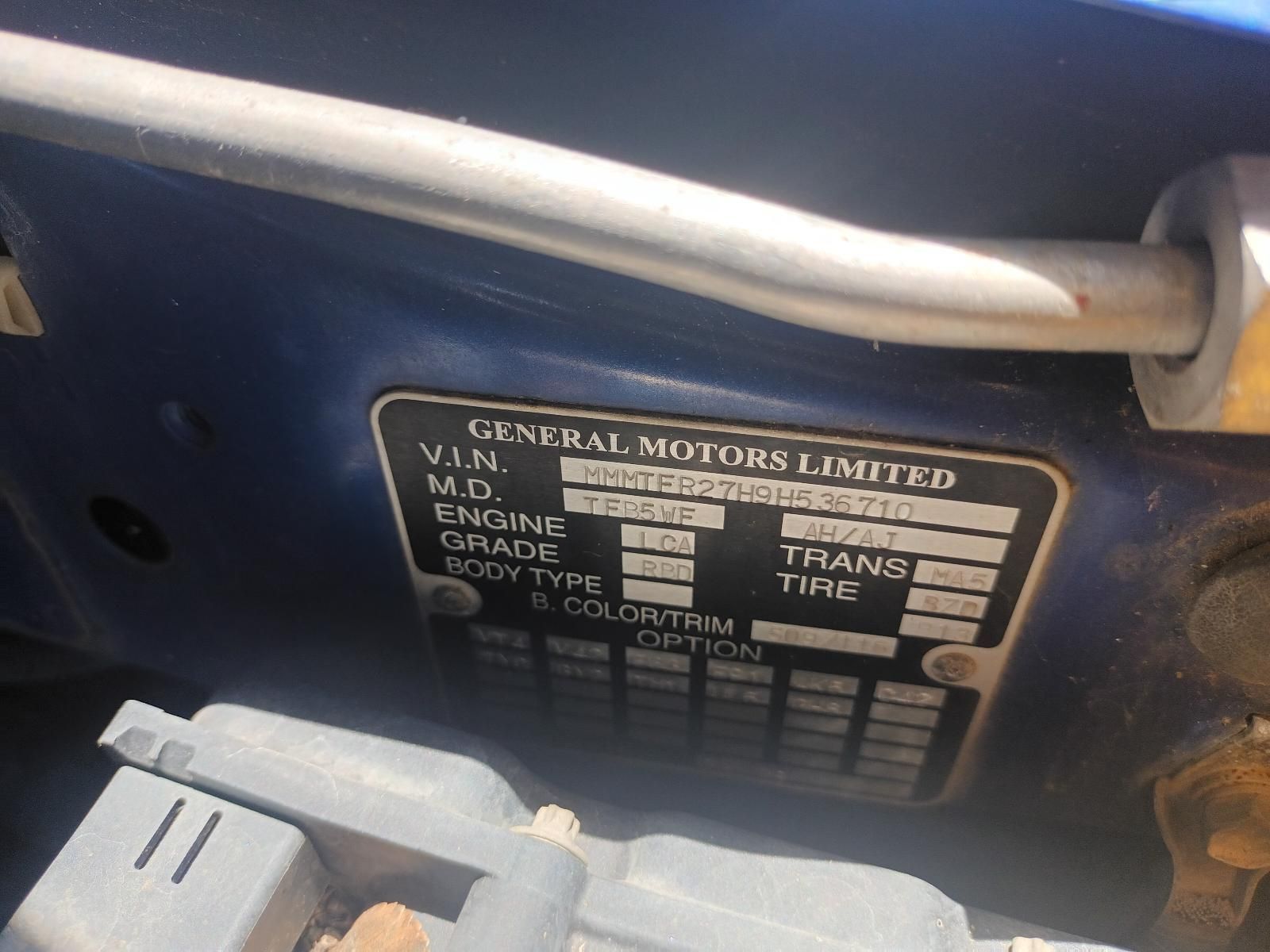 A Blue Car with a License Plate That Says General Motors Limited — South West 4WD Wreckers In Brisbane, QLD