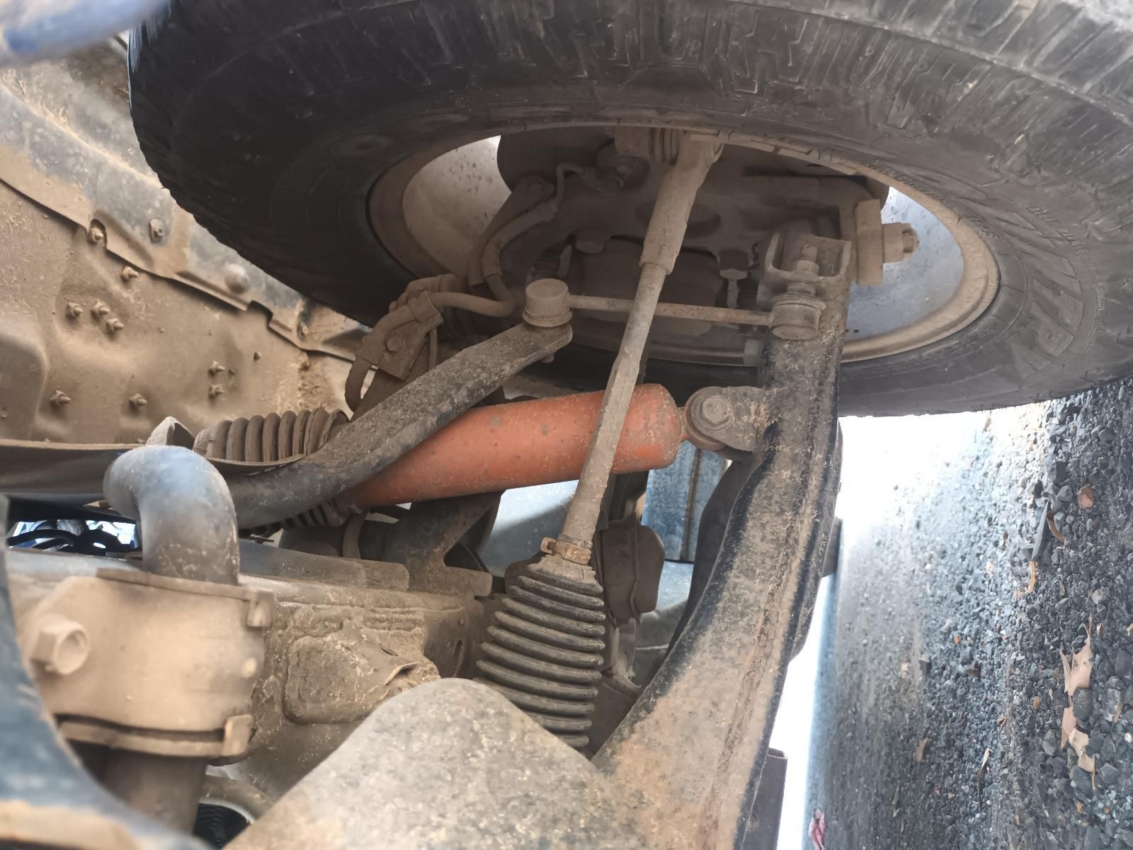 A Close Up of a Car's Suspension with a Tire in the Background — South West 4WD Wreckers In Brisbane, QLD