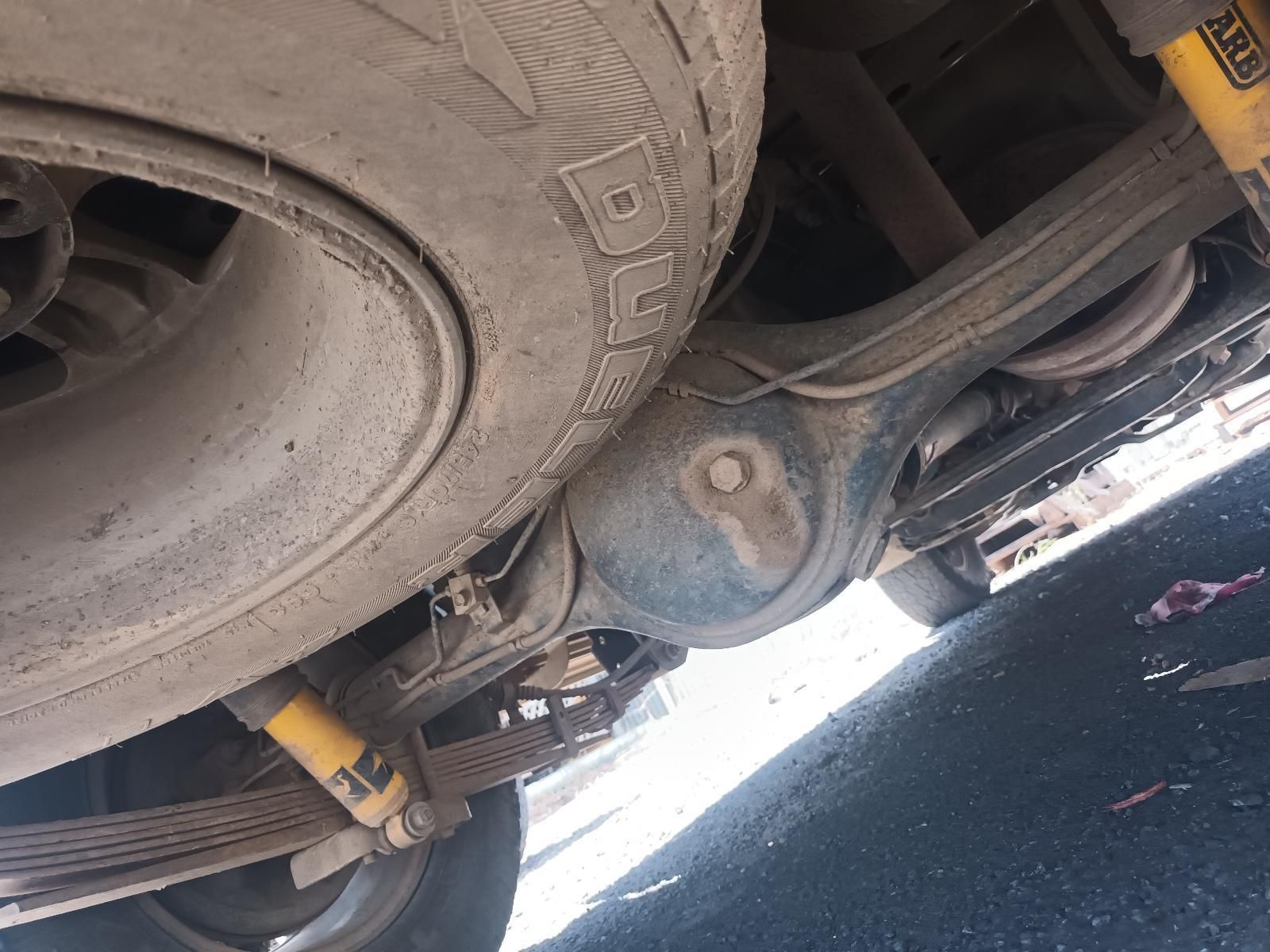 A Close Up of the Underside of a Car with a Tire on It — South West 4WD Wreckers In Brisbane, QLD