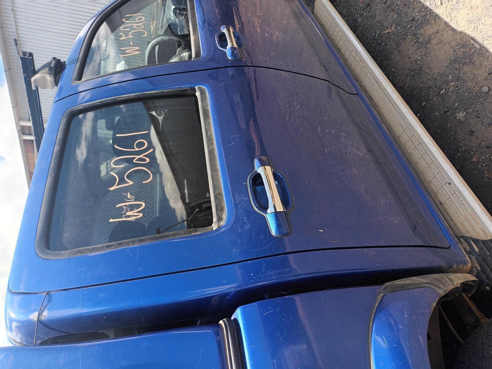 A Blue Truck is Parked on the Side of the Road — South West 4WD Wreckers In Brisbane, QLD