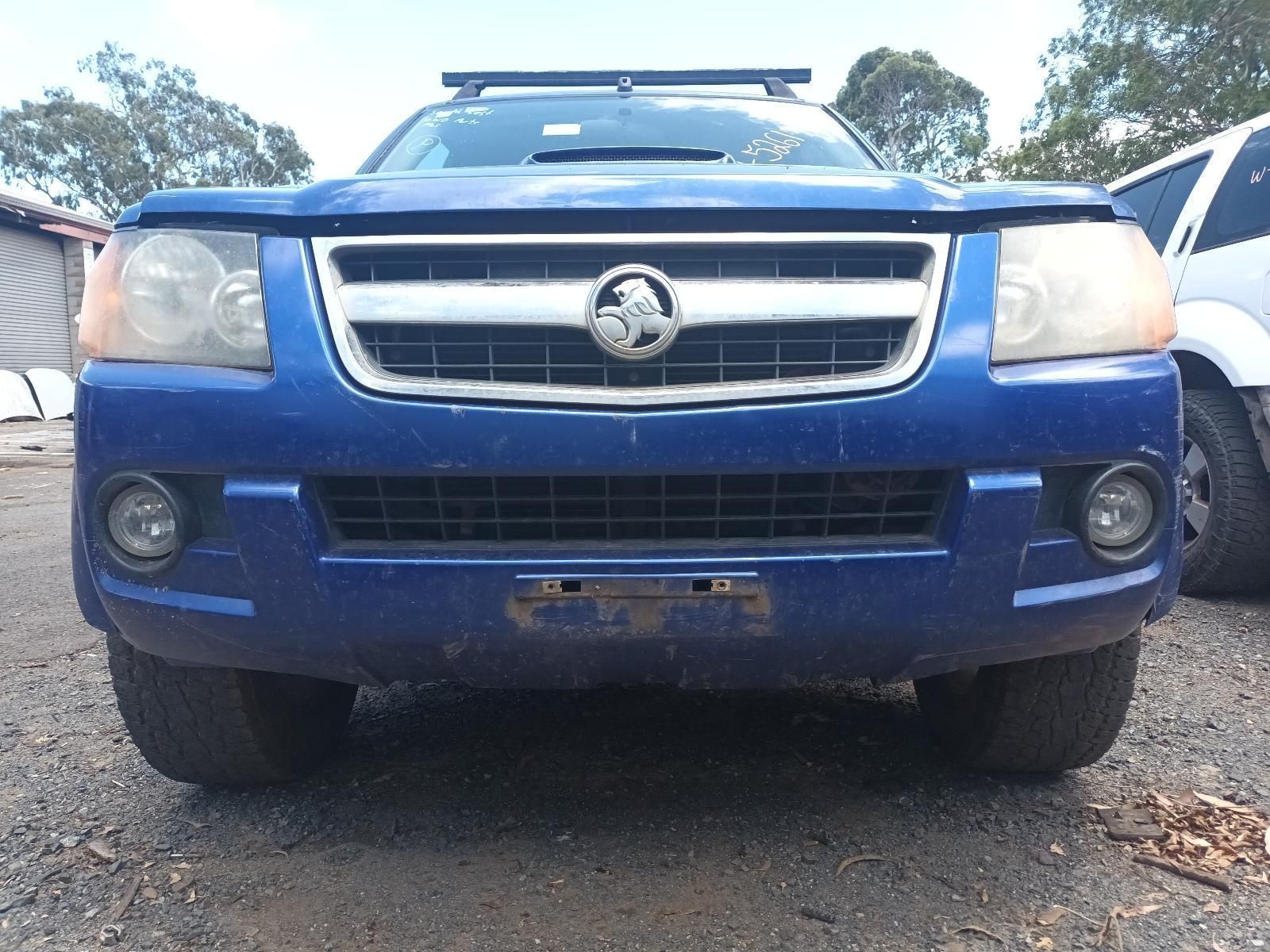 A Blue Vauxhall Truck is Parked in a Gravel Lot — South West 4WD Wreckers In Brisbane, QLD