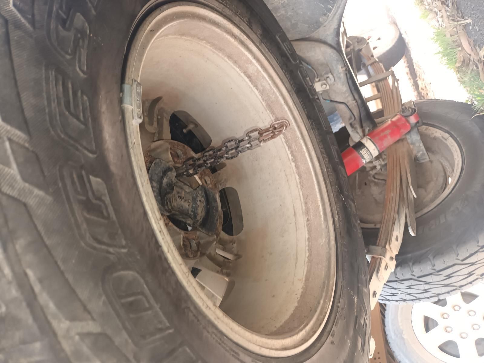 A Close Up of a Tire with a Chain Attached to It — South West 4WD Wreckers in Harristown, QLD