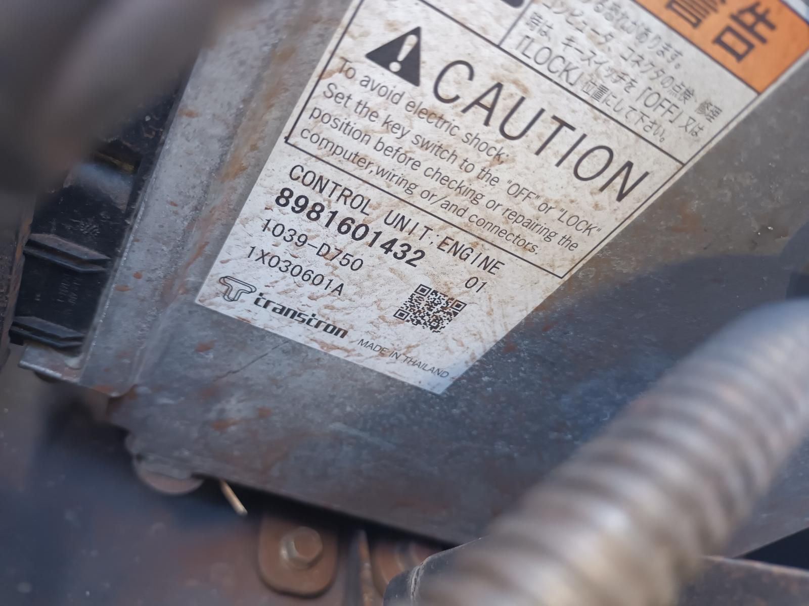 A Close Up of a Caution Sign on a Machine — South West 4WD Wreckers in Harristown, QLD