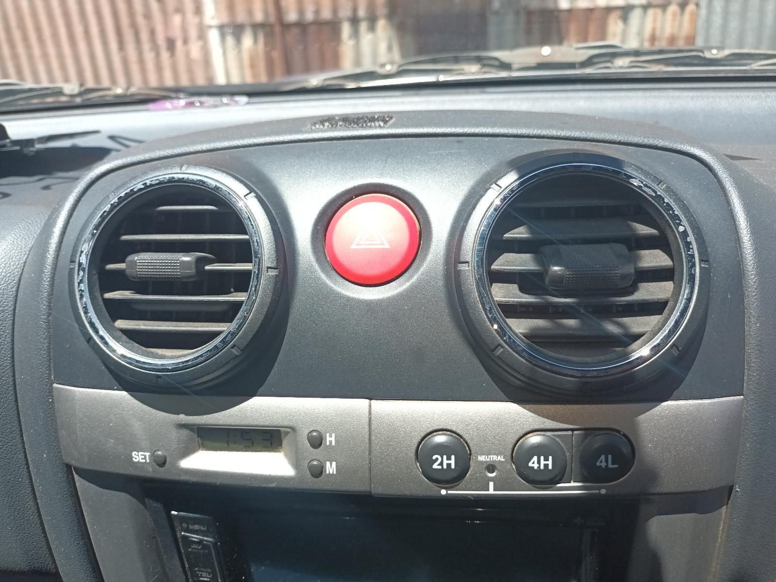 A Car Dashboard with a Red Button — South West 4WD Wreckers in Harristown, QLD