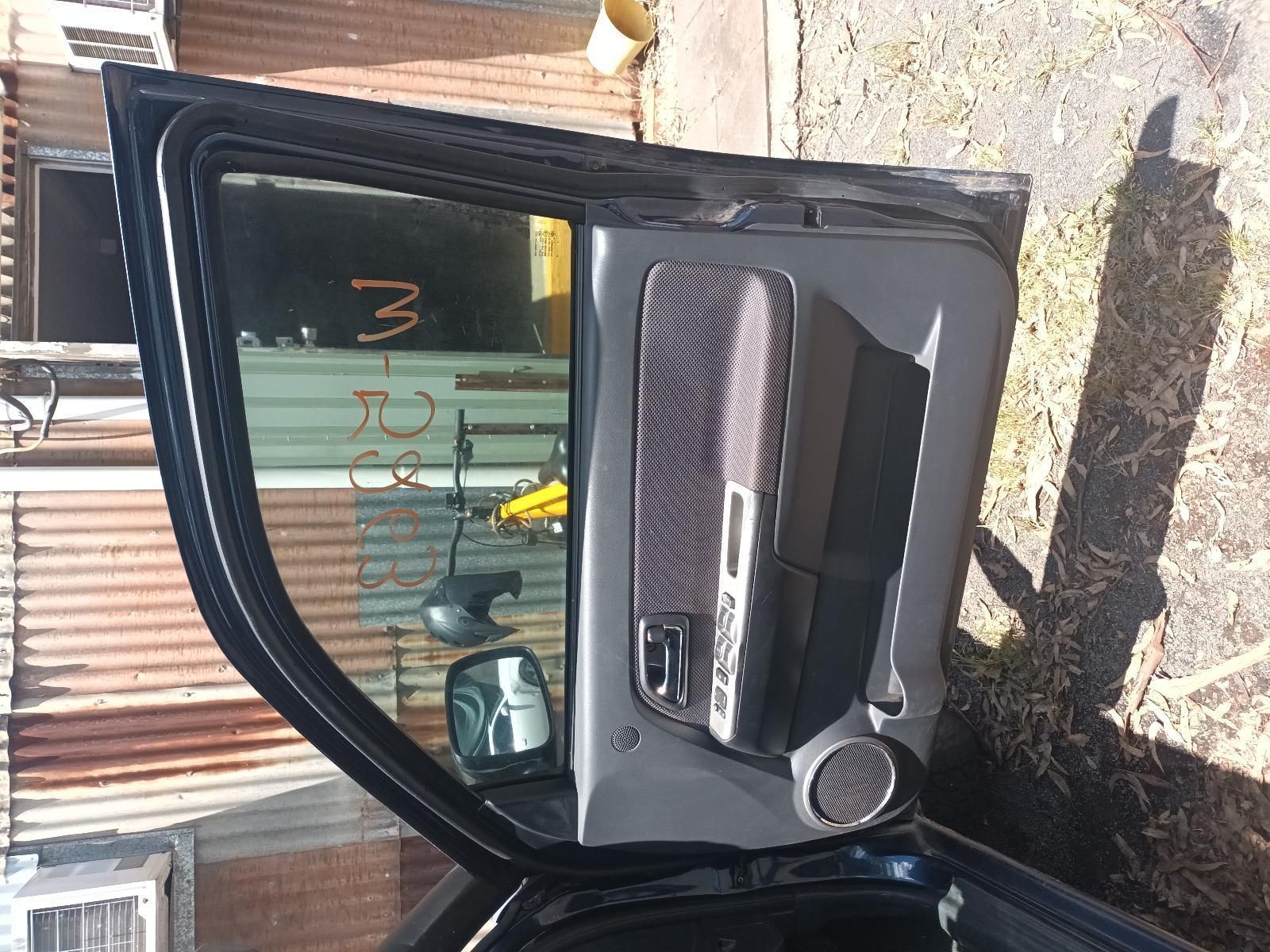 A Black Car with the Door Open — South West 4WD Wreckers in Harristown, QLD