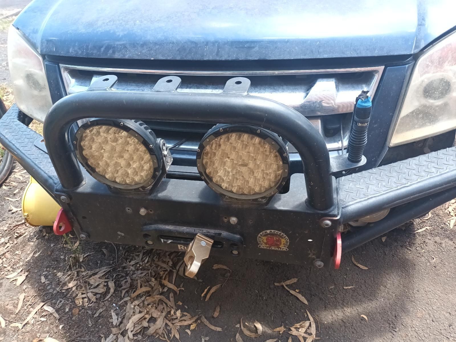 A Black Car with a Bumper and Lights on It — South West 4WD Wreckers in Harristown, QLD