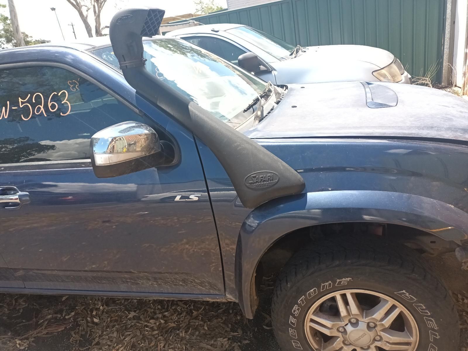 A Blue Truck with a Snorkel on the Hood is Parked in a Lot — South West 4WD Wreckers in Harristown, QLD