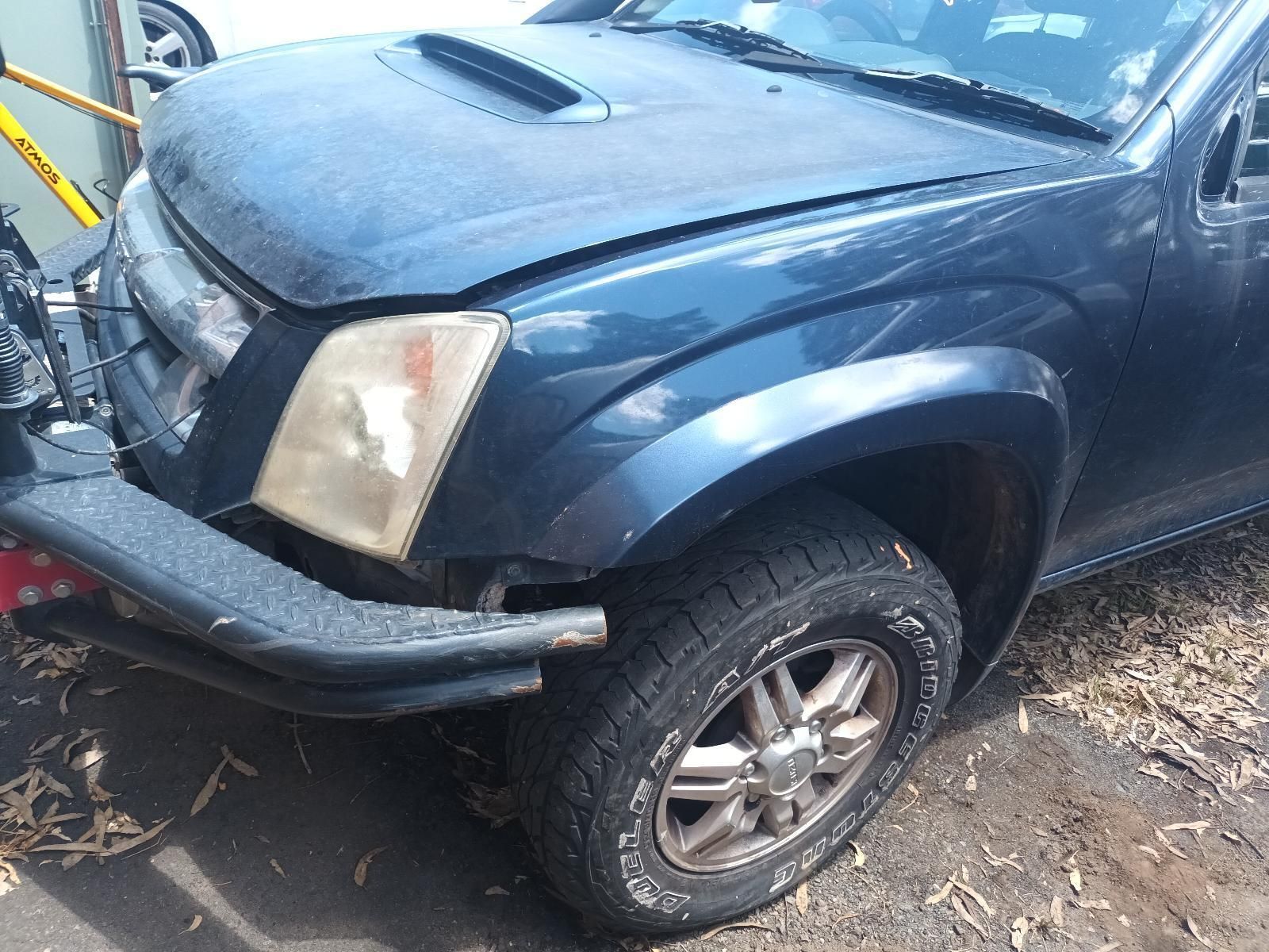 A Black Truck with the Hood Up is Parked on the Side of the Road — South West 4WD Wreckers in Harristown, QLD