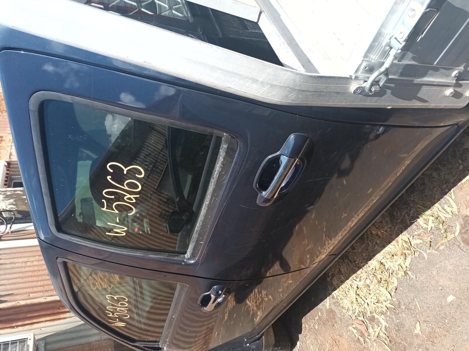 A Black Car is Parked on the Side of the Road — South West 4WD Wreckers in Harristown, QLD