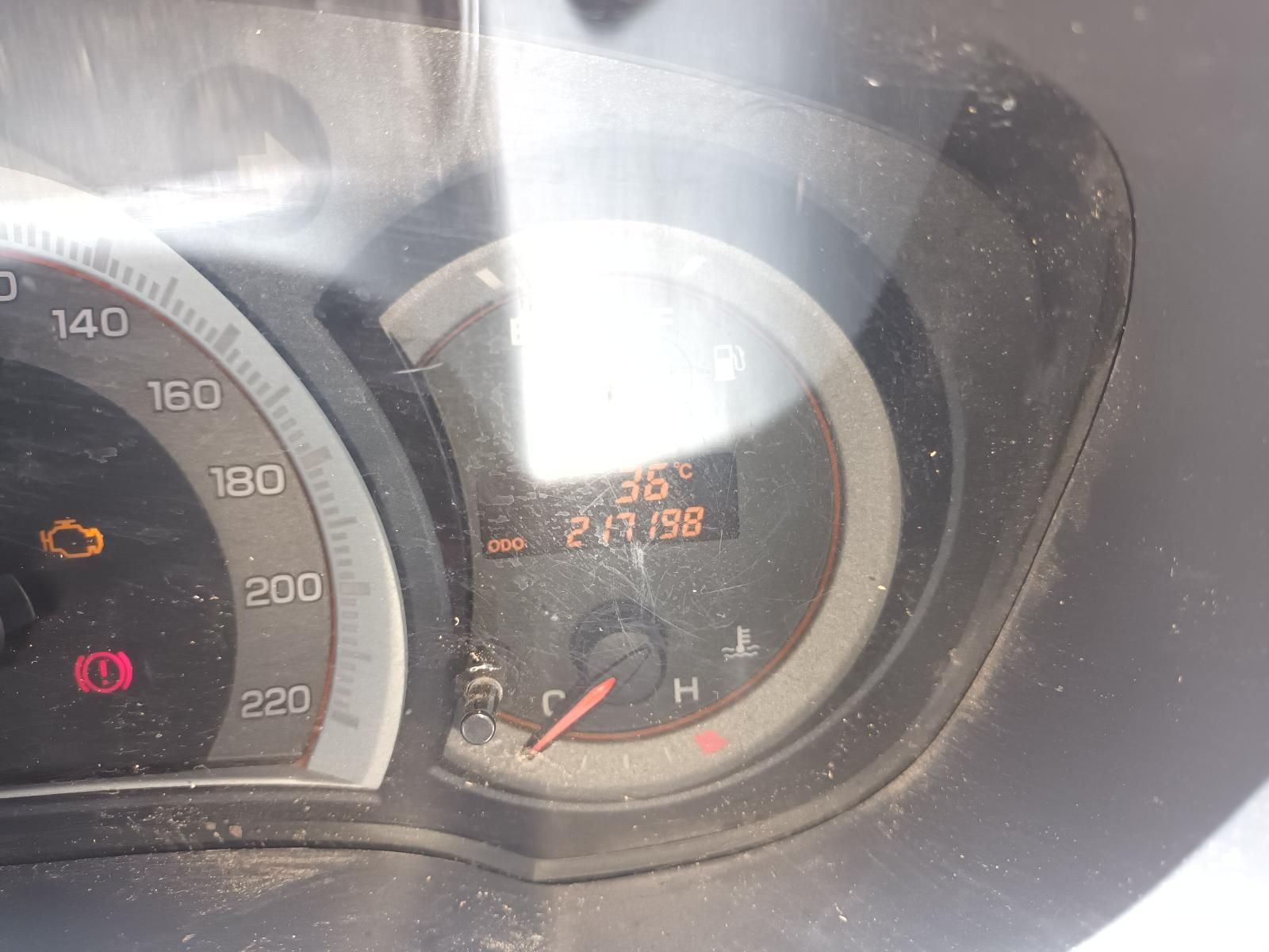 A close up of a car dashboard with a speedometer and a tachometer.