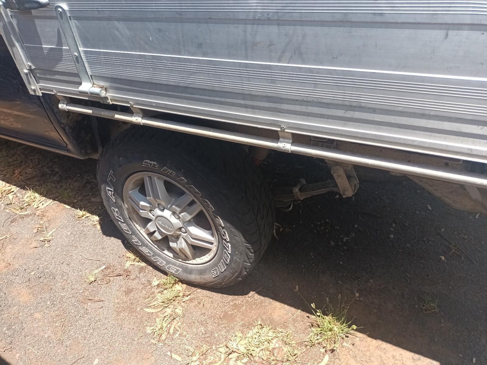 A Truck with a Flat Tire is Parked on the Side of the Road — South West 4WD Wreckers in Harristown, QLD